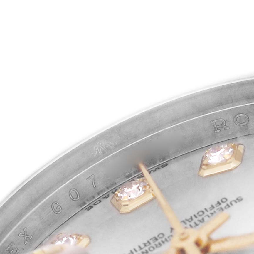 The image shows a close-up of the dial on a Rolex Datejust 179173 Women's Steel and Gold (two tone) Silver Dial watch, highlighting the bezel, diamond hour markers, and partial hands.