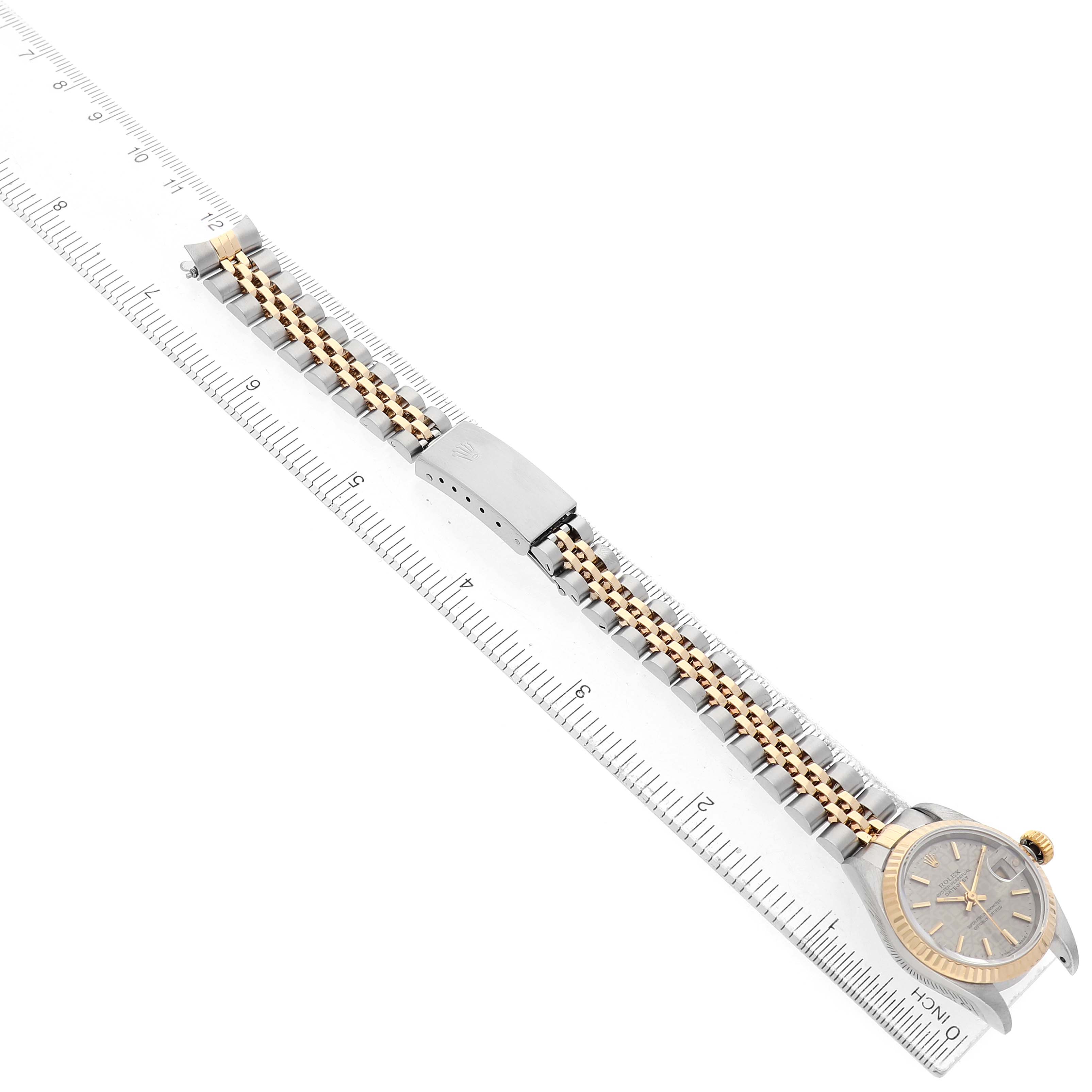 The image shows a Rolex Datejust 69173 Women's Steel and Gold (two tone) Silver Dial watch laid flat, showcasing the watch face, bracelet, and clasp in alignment with a ruler.