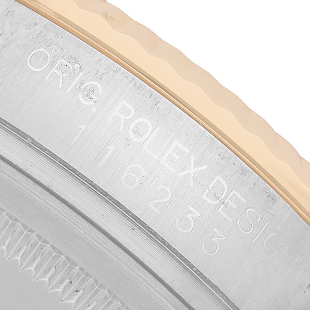 The image shows a close-up of the side view of the Rolex Datejust 116233 Men's Steel and Gold (two tone) Grey Dial's case with engraved details visible.