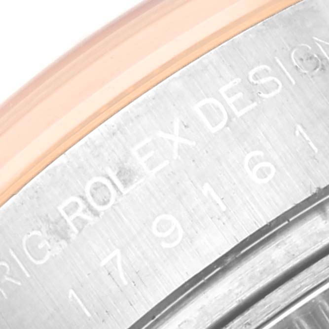 This image shows a close-up of the case back of a Rolex Datejust 179161 Women's Steel and Gold (two tone) Mother of Pearl Dial 179161 Women's Steel and Gold (two tone) Mother of Pearl Dial watch, focusing on the inscribed design and serial numbers.