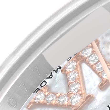 The image shows a close-up of the Rolex Datejust 179161 Women's Steel and Gold (two tone) Mother of Pearl Dial 179161 Women's Steel and Gold (two tone) Mother of Pearl Dial watch face highlighting the edge of the bezel, part of the dial, and a portion of a diamond-set numeral.