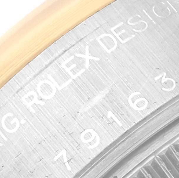 The image shows a close-up of the casing side of a Rolex Datejust 79163 Women's Steel and Gold (two tone) Champagne Dial 79163 Women's Steel and Gold (two tone) Champagne Dial, featuring the model and brand engraving.