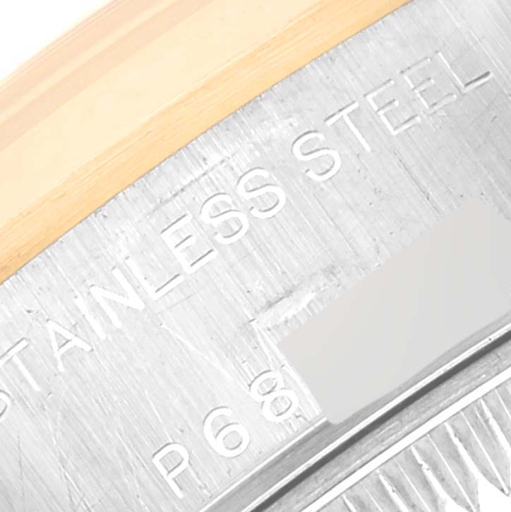 This close-up image shows the stainless steel back and part of the bezel of a Rolex Datejust 79163 Women's Steel and Gold (two tone) Champagne Dial 79163 Women's Steel and Gold (two tone) Champagne Dial watch.