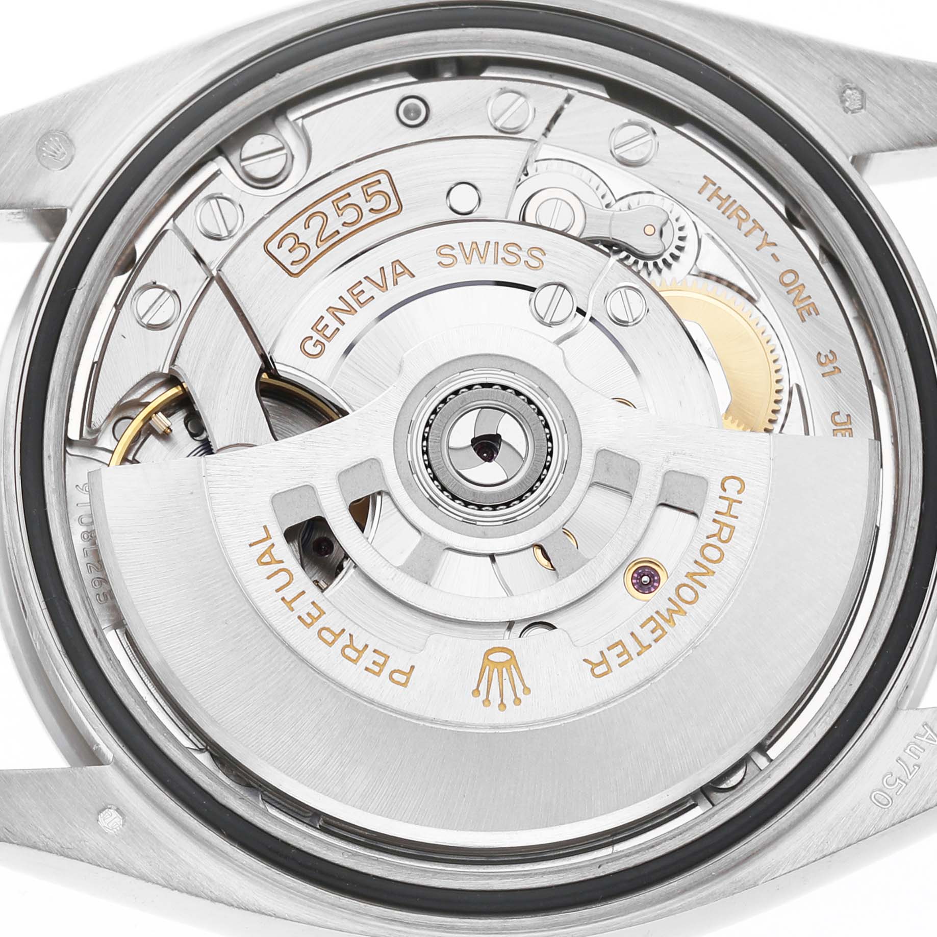 The image shows the movement of a Rolex Date 128239 Men's White Gold White Dial model, showcasing the rotor and intricate mechanical components.