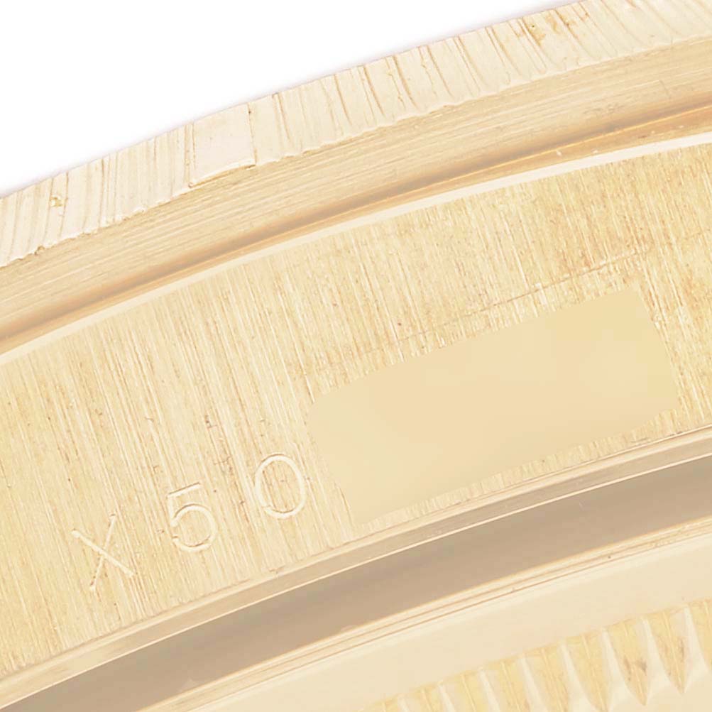 The image shows a close-up of the bezel and part of the casing of a Rolex President 18248 Men
s Yellow Gold Champagne Dial 18248 Men
s Yellow Gold Champagne Dial model watch.
