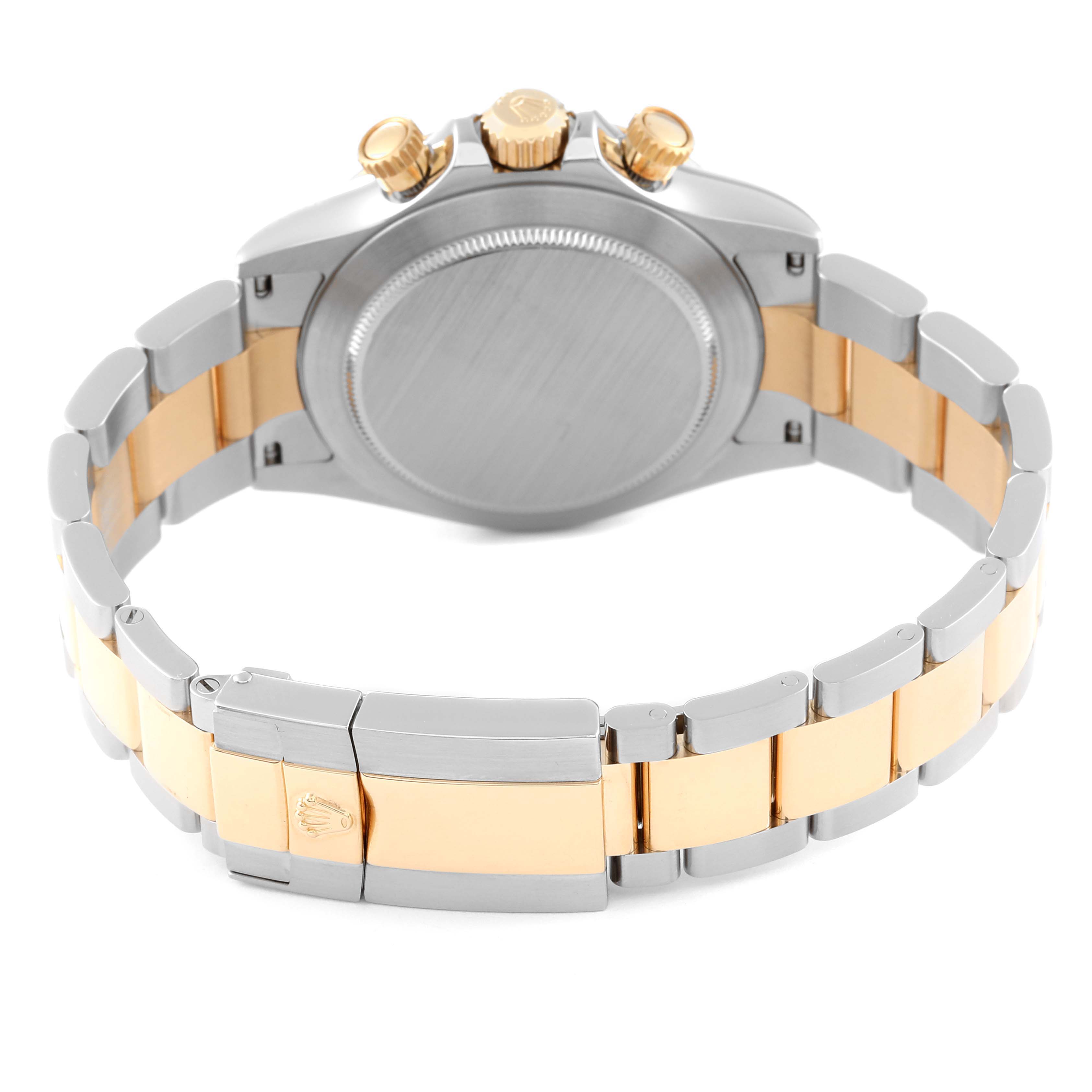 This image shows the back view of a Rolex Daytona 116523 Men's Steel and Gold (two tone) Mother of Pearl Dial 116523 Men's Steel and Gold (two tone) Mother of Pearl Dial watch, highlighting its clasp, bracelet, case back, and crown.