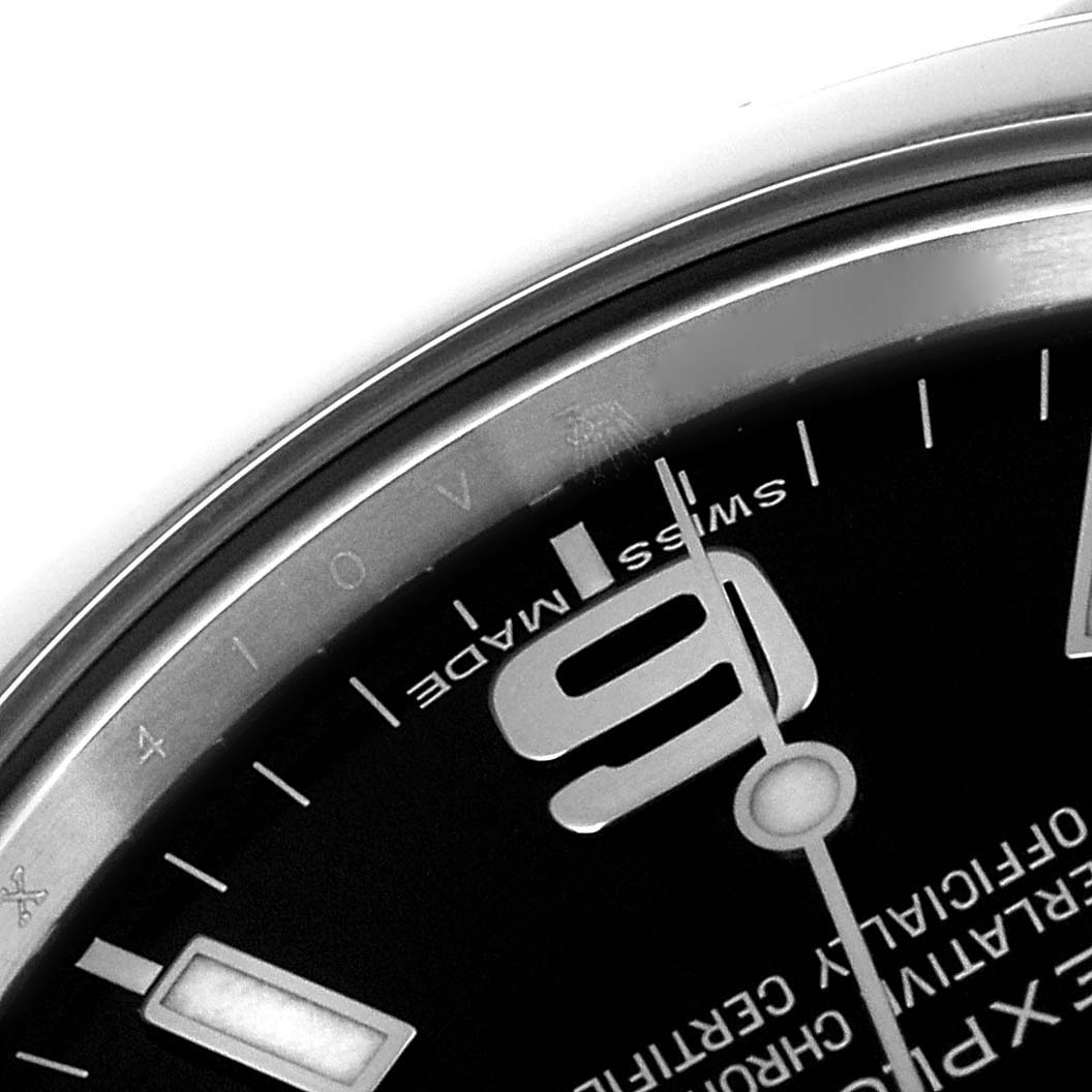 The image shows a close-up of the dial of a Rolex Explorer 214270 Men's Stainless Steel Black Dial 214270 Men's Stainless Steel Black Dial watch, focusing on the "swiss made" text and 9 o'clock marker.