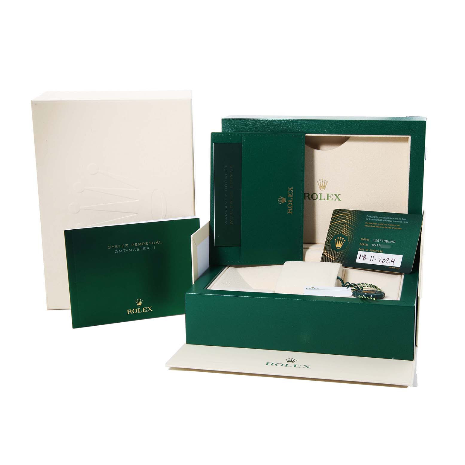 The image shows packaging and warranty papers for a Rolex GMT-Master 126710BLNR Men's Stainless Steel Black Dial, including boxes and booklets.