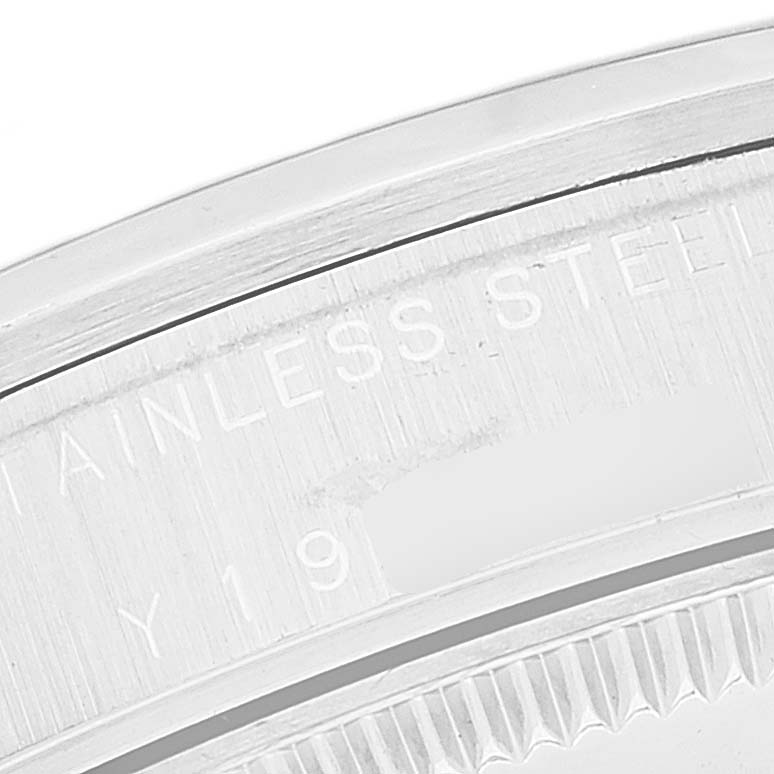 This image shows a close-up of the case back and engravings of a Rolex Mid-Size 77080 Women
s Stainless Steel Blue Dial 77080 Women
s Stainless Steel Blue Dial model watch.