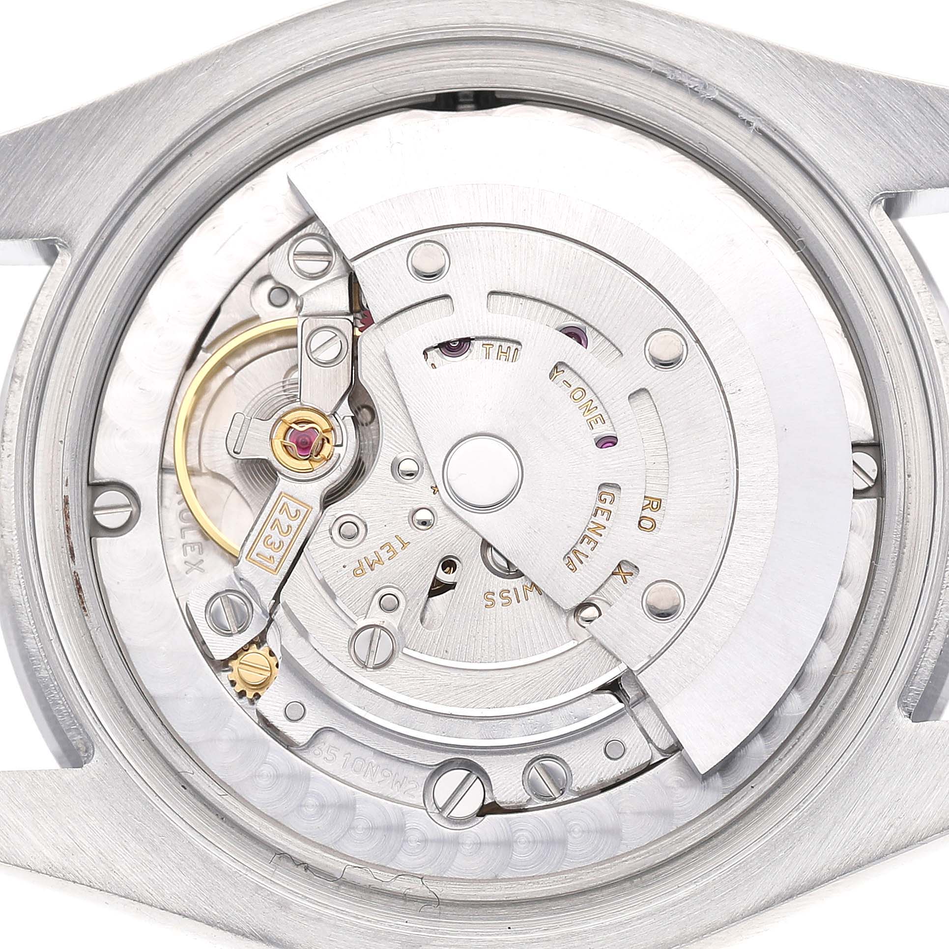 The image shows the movement of a Rolex Oyster Perpetual 177200 Women's Stainless Steel Grey Dial watch viewed from the back, highlighting gears and components.