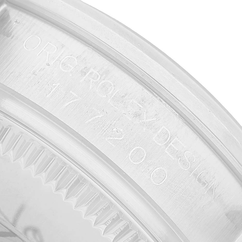 The image shows the case back edge of a Rolex Oyster Perpetual 177200 Women's Stainless Steel Grey Dial, focusing on the engraved text.