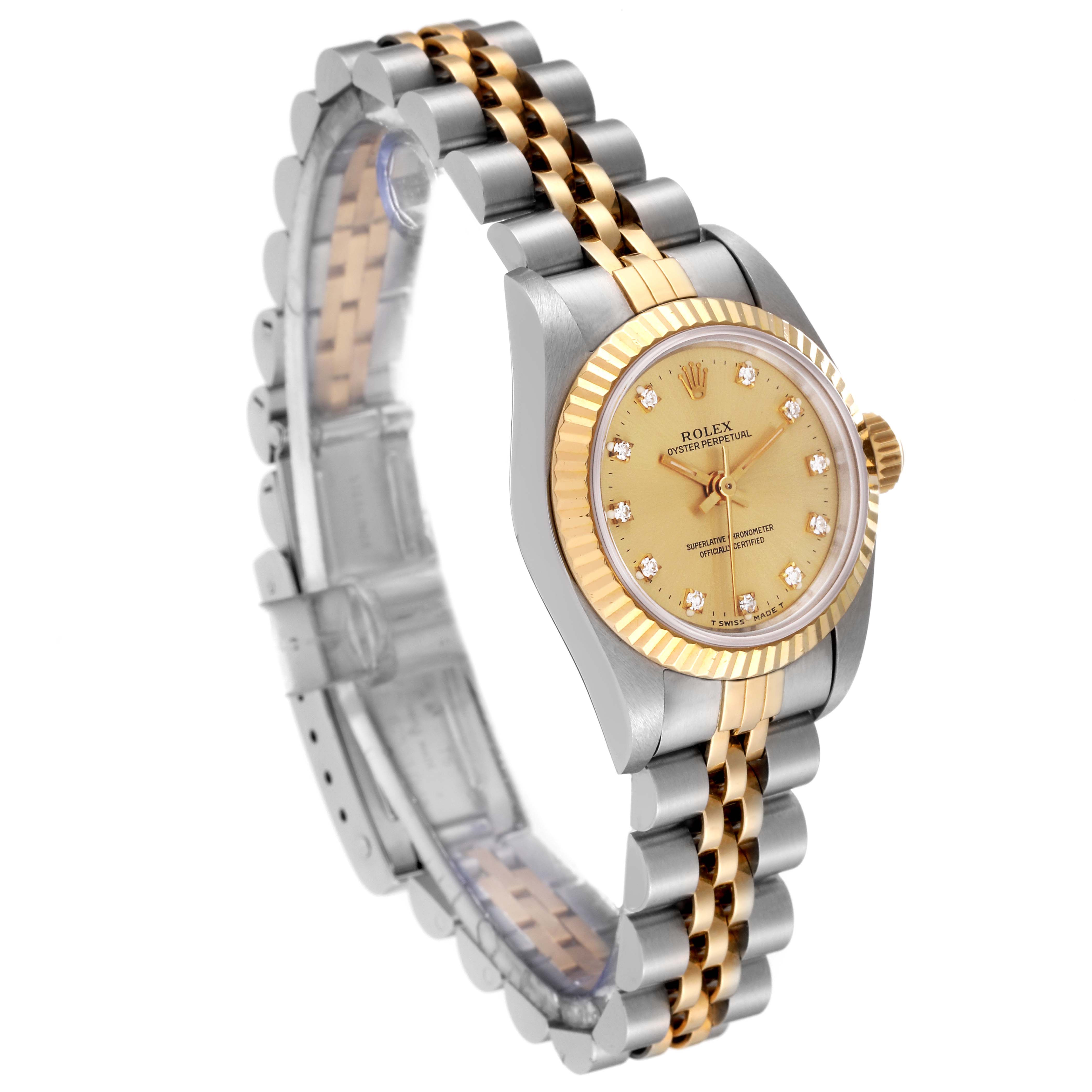 The Rolex Oyster Perpetual M67193 Women's Steel and Gold (two tone) Champagne Dial M67193 Women's Steel and Gold (two tone) Champagne Dial watch is shown at a slight angle, displaying its gold and silver bracelet and champagne dial with diamond markers.