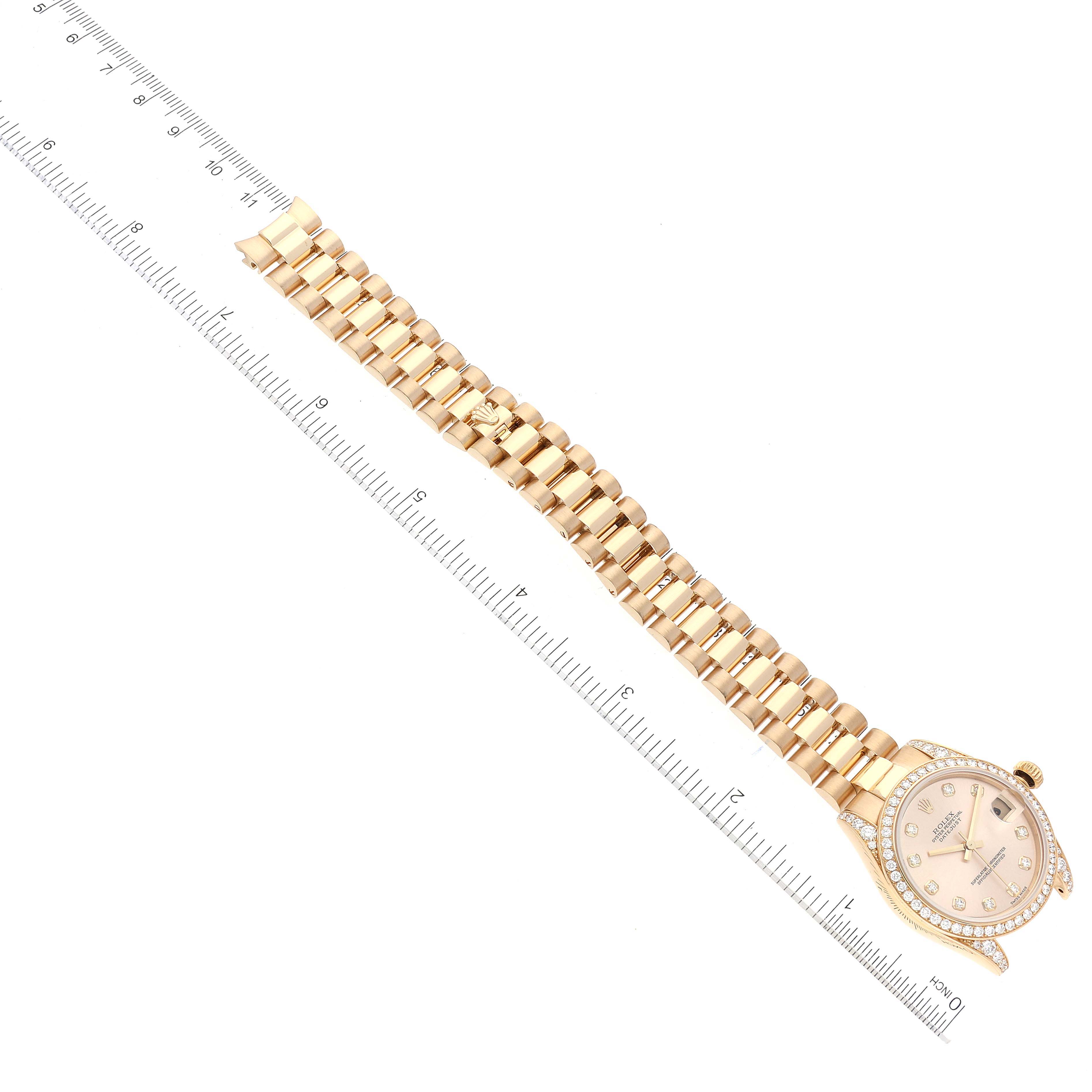 The image shows a Rolex President 178158 Women
s Yellow Gold Champagne Dial 178158 Women
s Yellow Gold Champagne Dial model watch laid flat next to a measuring ruler, displaying the bracelet and watch face.