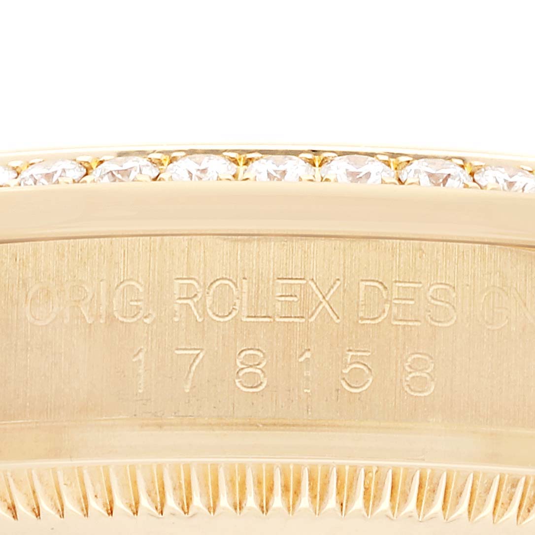 This close-up image shows the model number engraving on the side of a Rolex President 178158 Women
s Yellow Gold Champagne Dial 178158 Women
s Yellow Gold Champagne Dial watch case.
