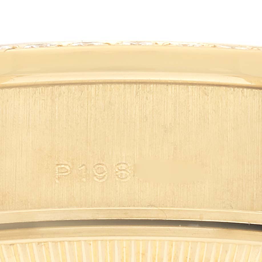 This close-up image shows the engraved serial number on the case back of a Rolex President 79138G Women
s Yellow Gold Champagne Dial 79138G Women
s Yellow Gold Champagne Dial model watch.