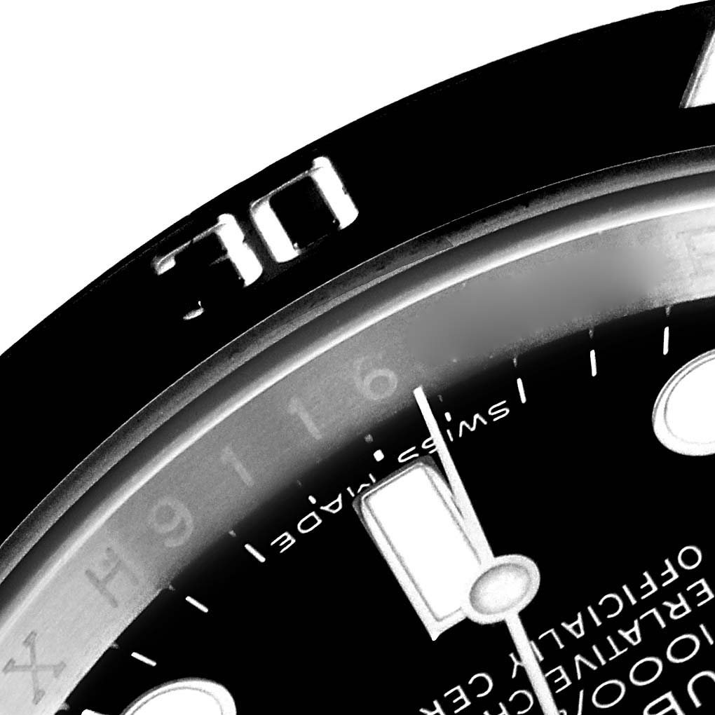 The image shows a close-up of the bezel and part of the dial of the Rolex Submariner 116610 Men
s Stainless Steel Black Dial 116610 Men
s Stainless Steel Black Dial model watch.