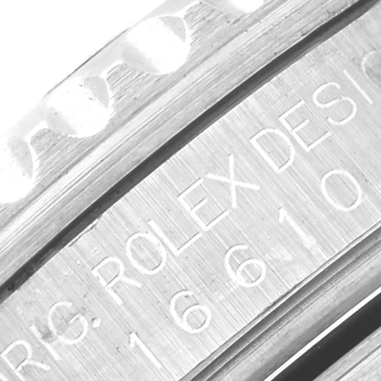 The image shows an engraving on the inner bezel of the Rolex Submariner 16610 Men
s Stainless Steel Black Dial 16610 Men
s Stainless Steel Black Dial watch, highlighting the model number.