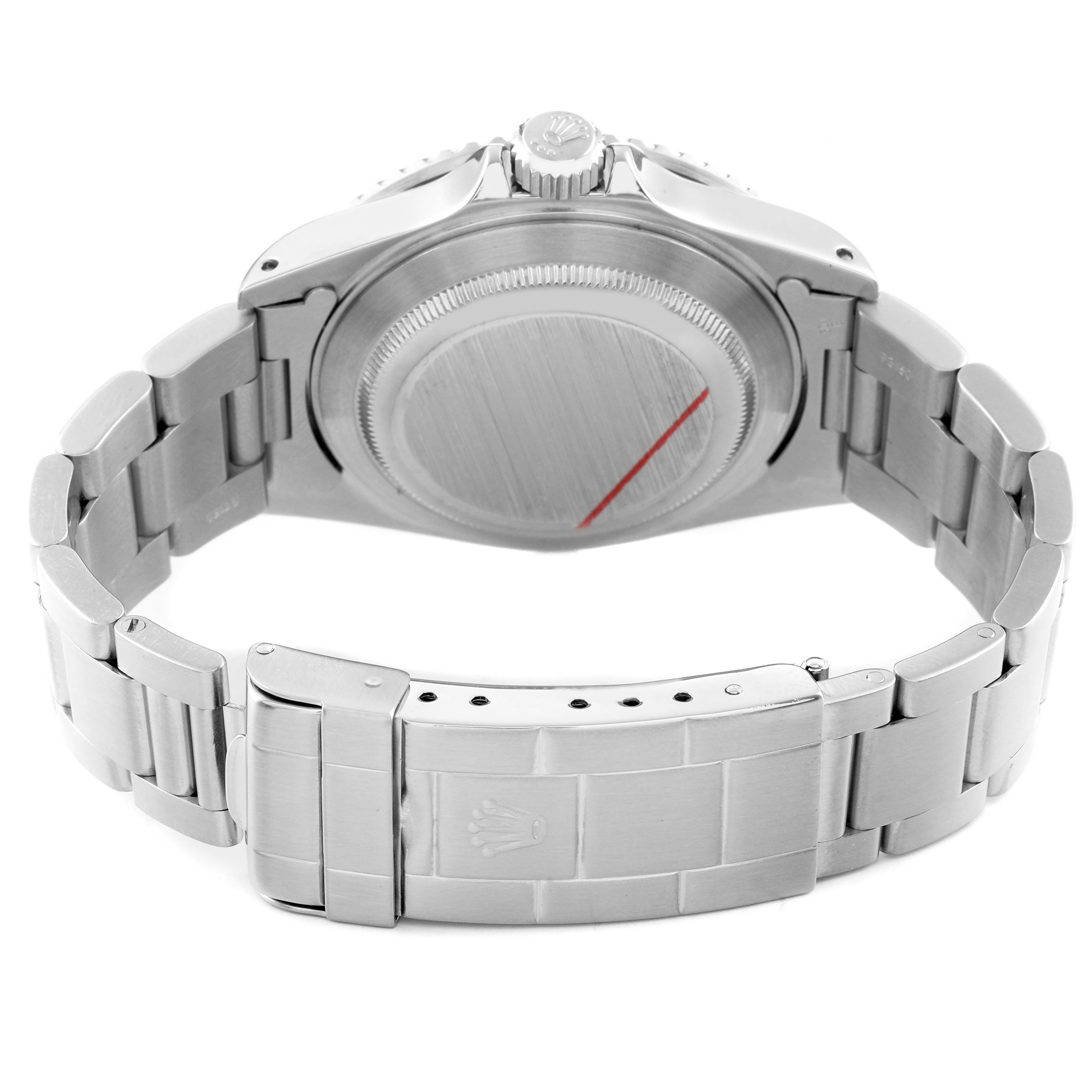 The image shows the back view of a Rolex Submariner 16610 Men's Stainless Steel Black Dial, highlighting the case back, crown, and stainless steel bracelet with clasp.