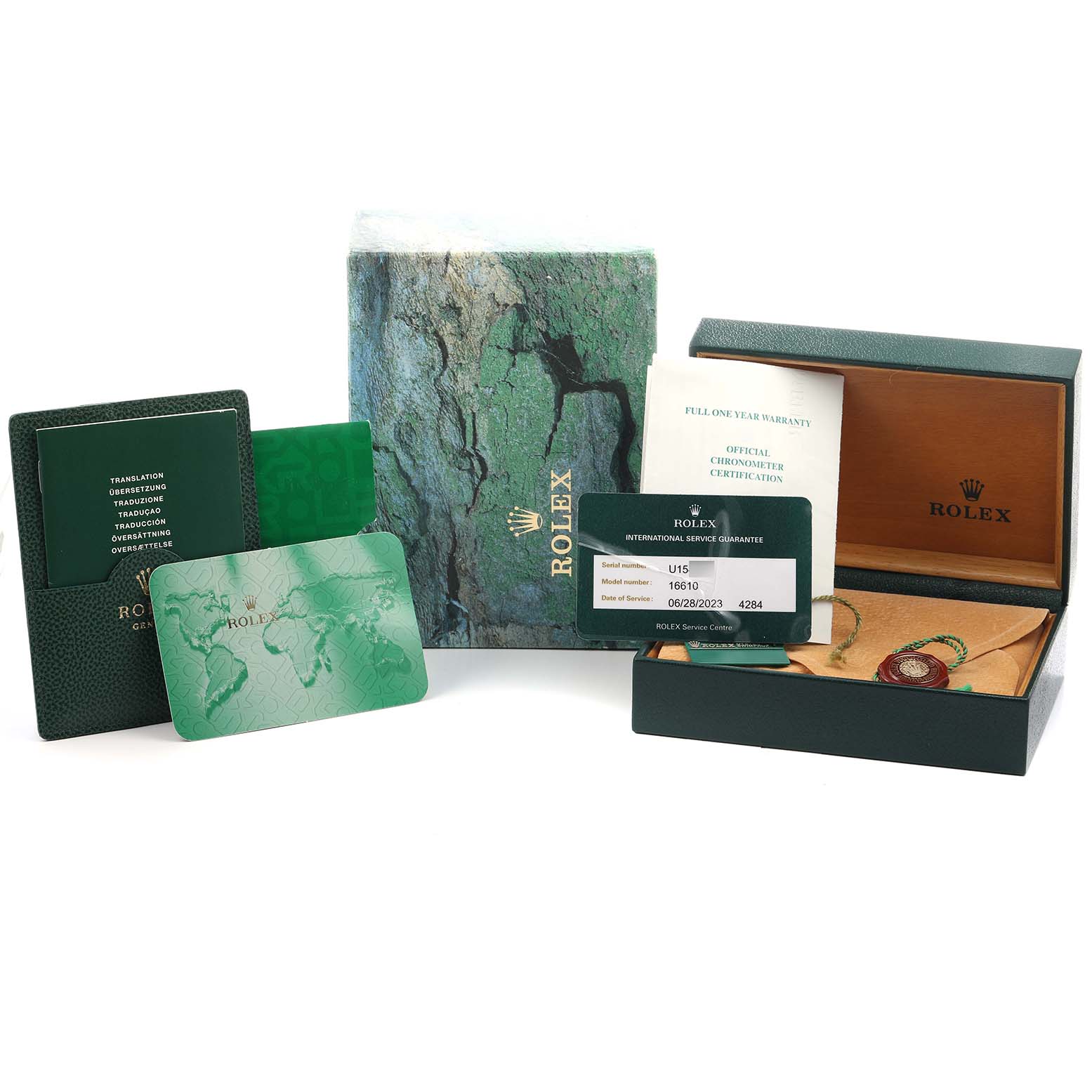 The image shows a Rolex Submariner 16610 Men's Stainless Steel Black Dial's box, warranty cards, manual, and certification documents from an overhead angle.