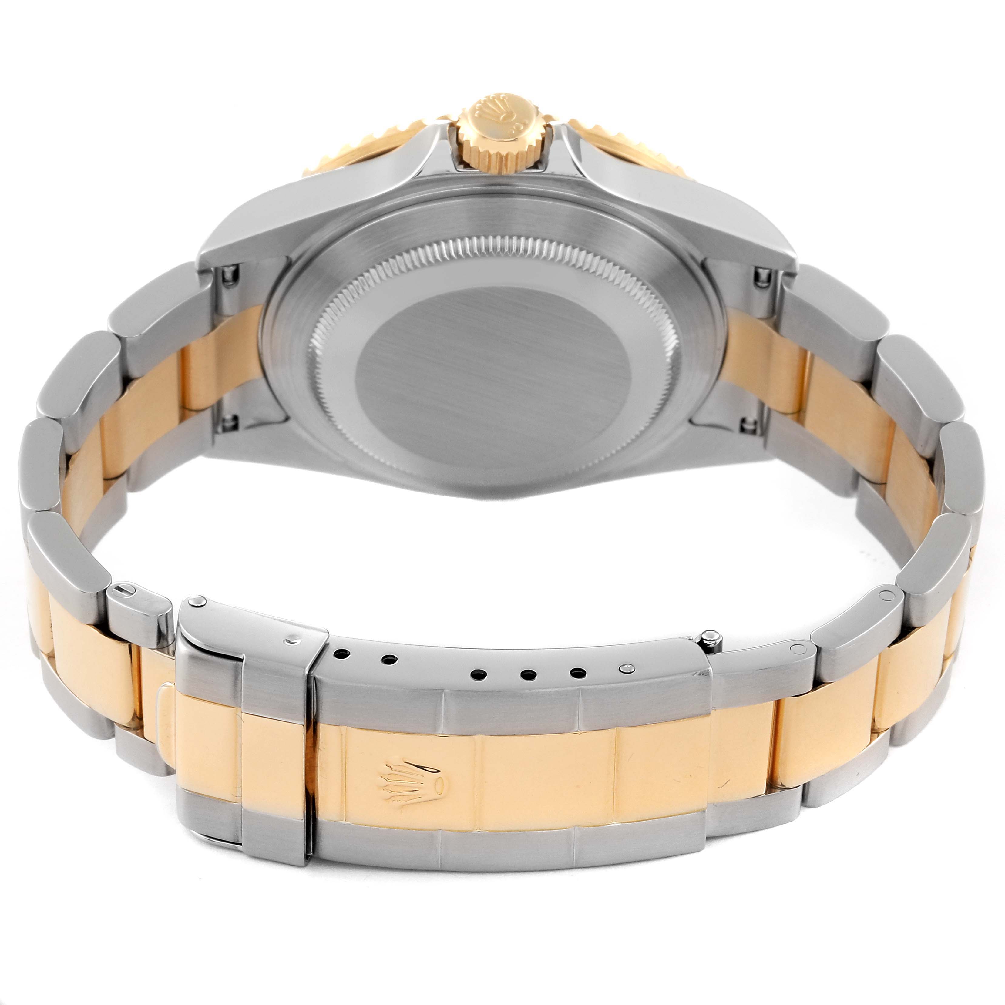 This image shows the back of a Rolex Submariner 16613 Men's Steel and Gold (two tone) Champagne Dial 16613 Men's Steel and Gold (two tone) Champagne Dial watch, highlighting the case back, bracelet, and clasp.