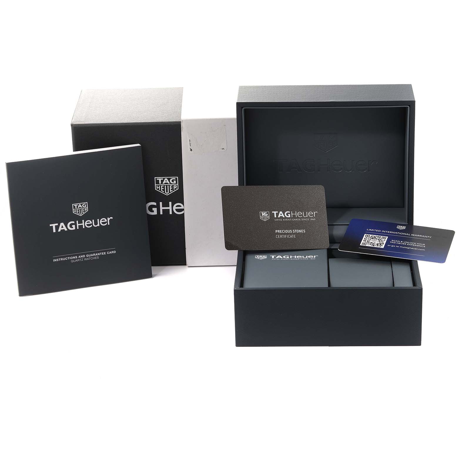 The image shows the packaging, warranty cards, and instructions for a Tag Heuer Aquaracer WAY1414.BA0920 Women's Stainless Steel Mother of Pearl Dial WAY1414.BA0920 Women's Stainless Steel Mother of Pearl Dial watch, taken from a frontal angle.