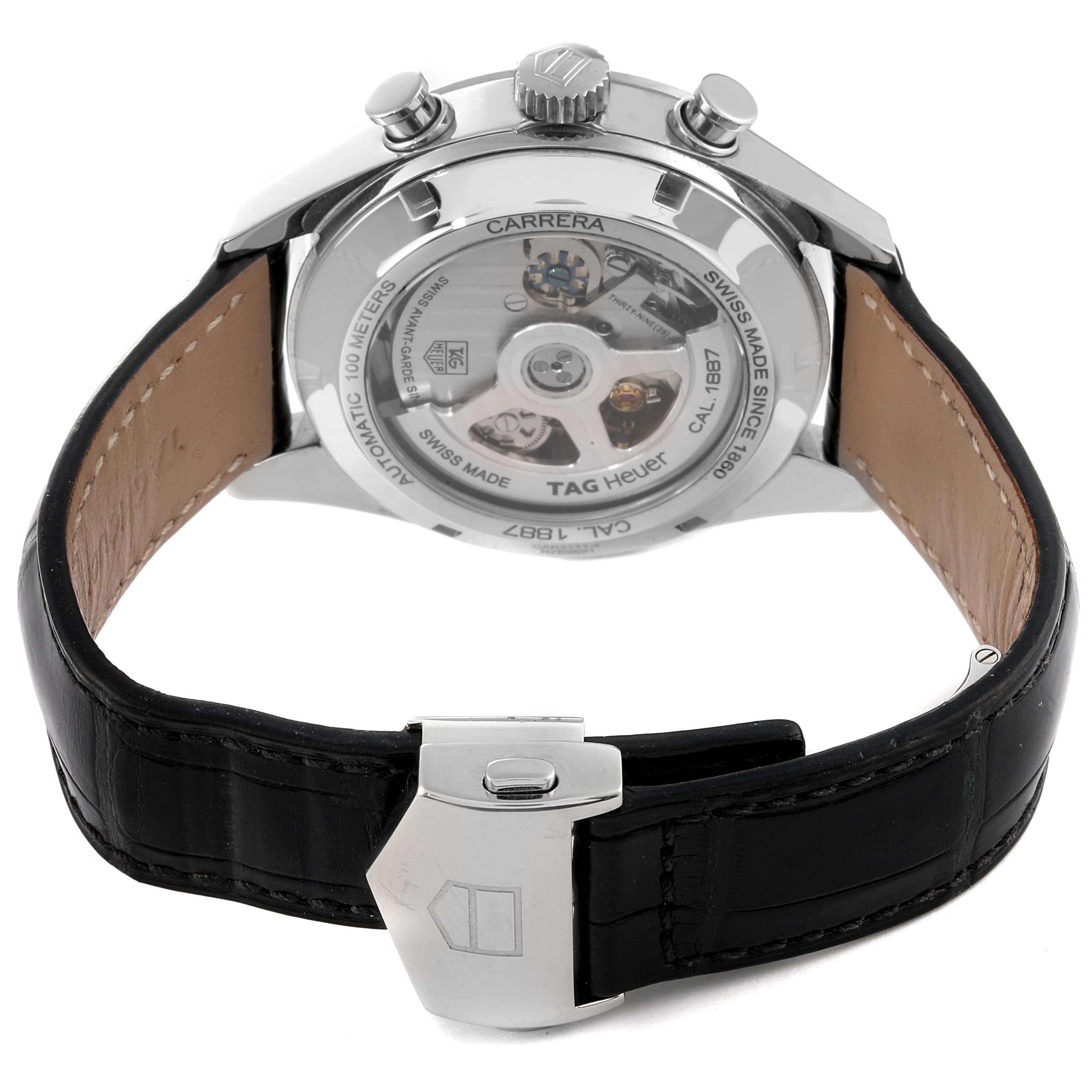 The image shows the back view of a Tag Heuer Carrera CAR2111 Men's Stainless Steel Silver Dial CAR2111 Men's Stainless Steel Silver Dial watch with its leather strap and exposed movement.