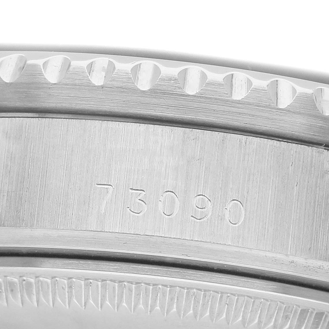 The image shows a close-up of the bezel and case side with engraved numbers on the Tudor Prince 73090 Men's Stainless Steel Black Dial watch.