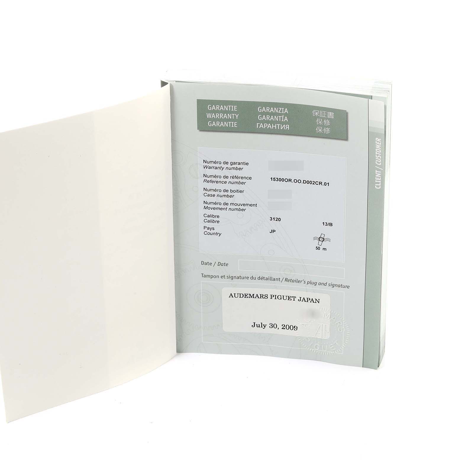 The image shows the warranty booklet for a Royal Oak model by Audemars Piguet, displaying warranty details.