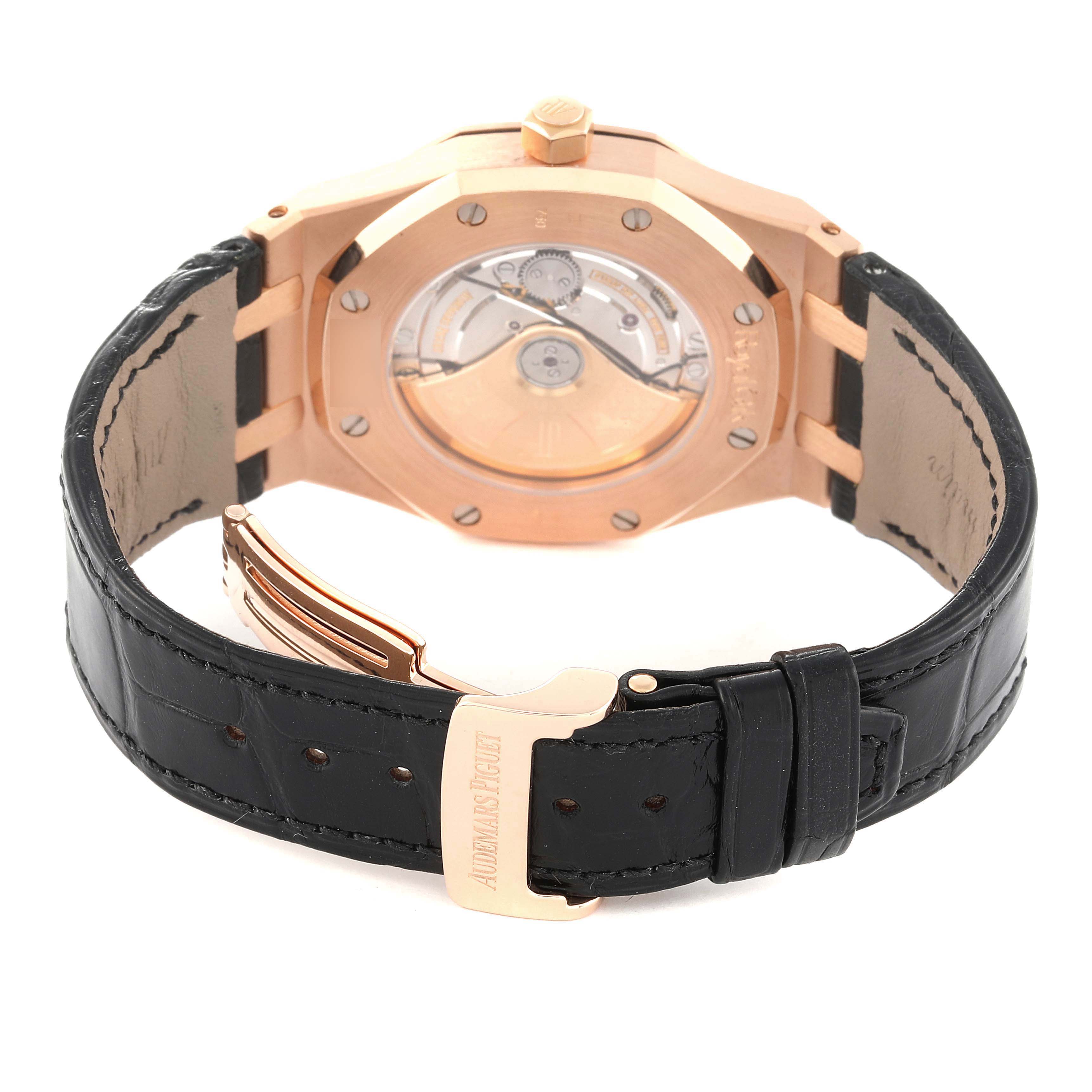 This image shows the back view of a Royal Oak model by Audemars Piguet, highlighting its movement and black leather strap.