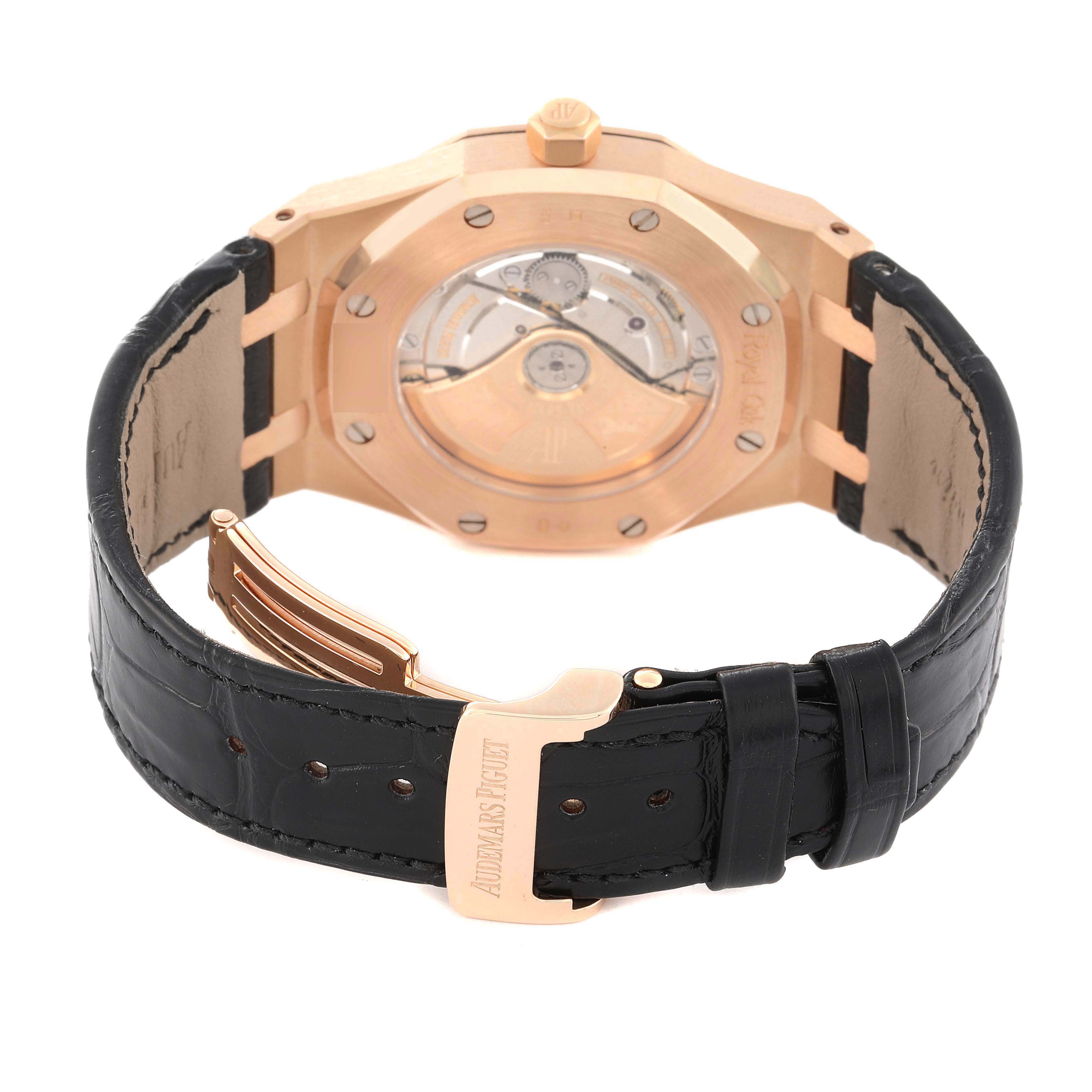 The image shows the back view of an Audemars Piguet Royal Oak 15300OR.OO.D002CR.01 Men
s Rose Gold Black Dial 15300OR.OO.D002CR.01 Men
s Rose Gold Black Dial watch, highlighting the case back and black leather strap with the clasp visible.