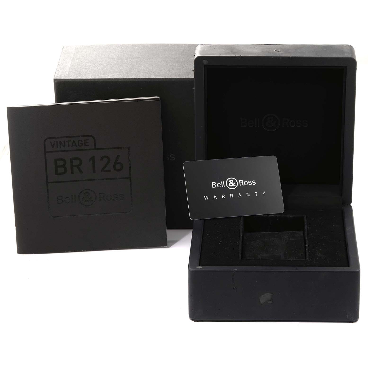 The image shows the packaging, box, and warranty card for the Bell 
Ross Heritage BRV126-RS40-ST Men
s Stainless Steel Black Dial BRV126-RS40-ST Men
s Stainless Steel Black Dial model BR126.