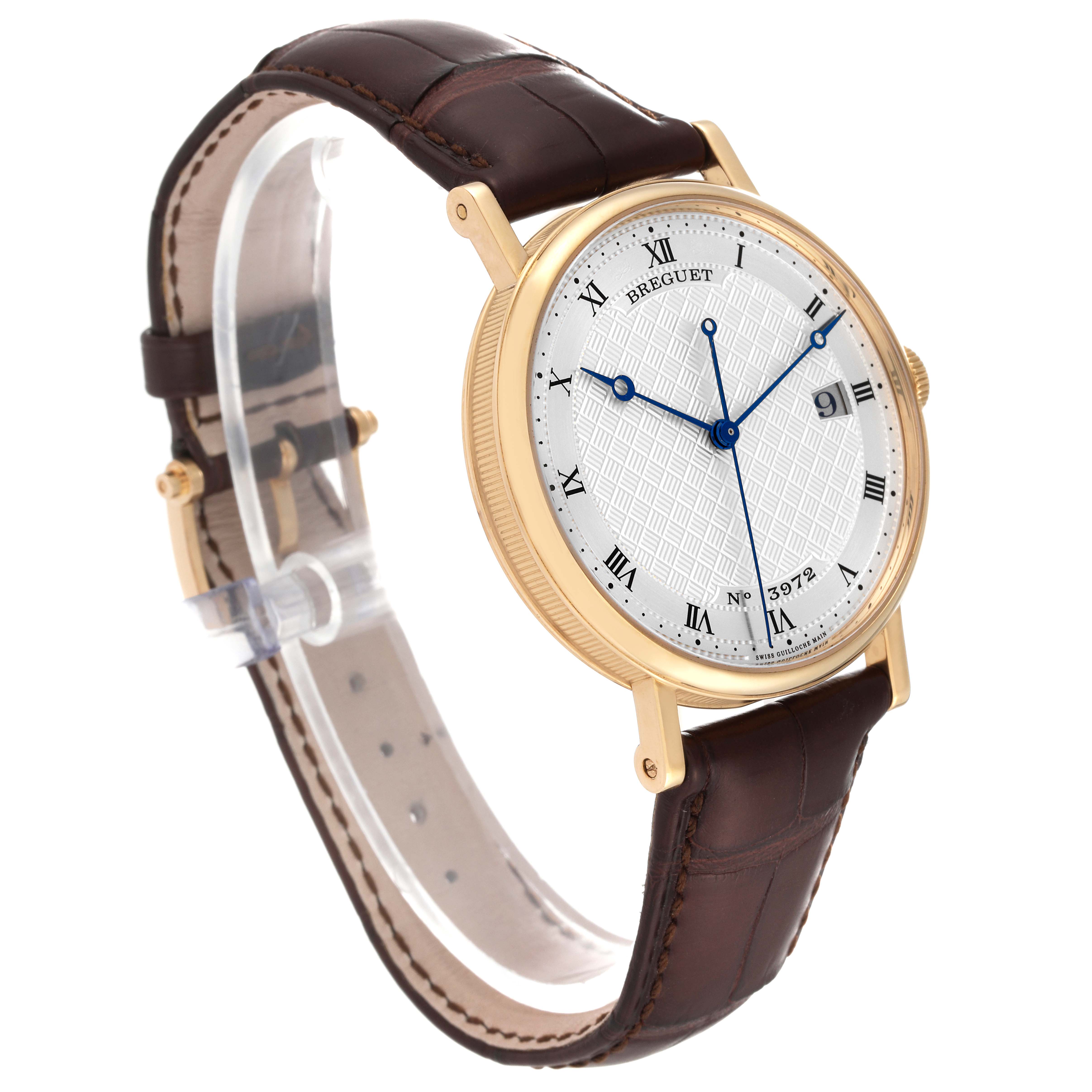 The Breguet Classique 5177BA/12/9V6 Men's Yellow Gold Silver Dial 5177BA/12/9V6 Men's Yellow Gold Silver Dial watch is shown at a three-quarter angle, highlighting the dial, strap, and case.