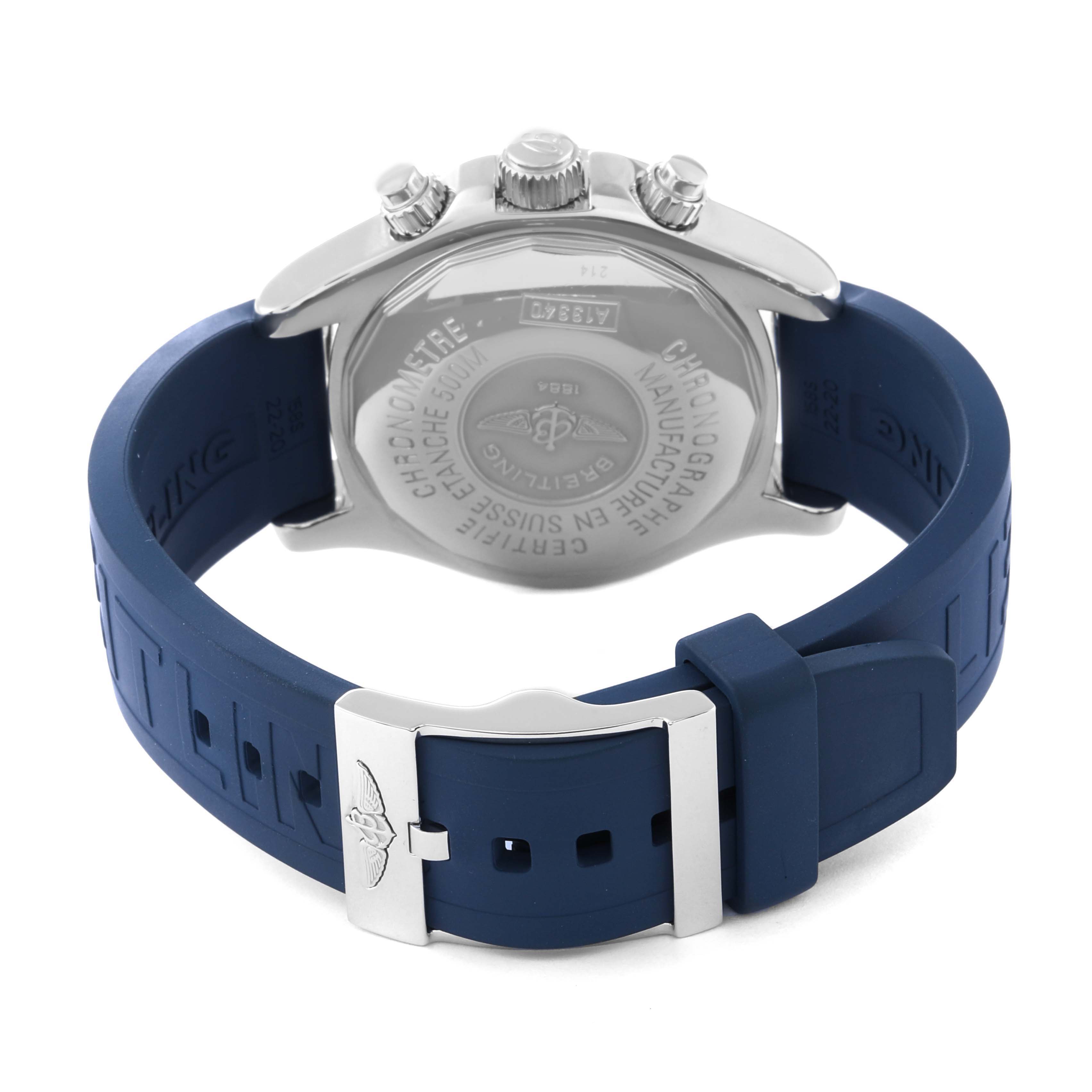 The image shows the back view of the Breitling Superocean A13340 Men's Stainless Steel Silver Dial A13340 Men's Stainless Steel Silver Dial watch with a blue rubber strap and silver clasp.