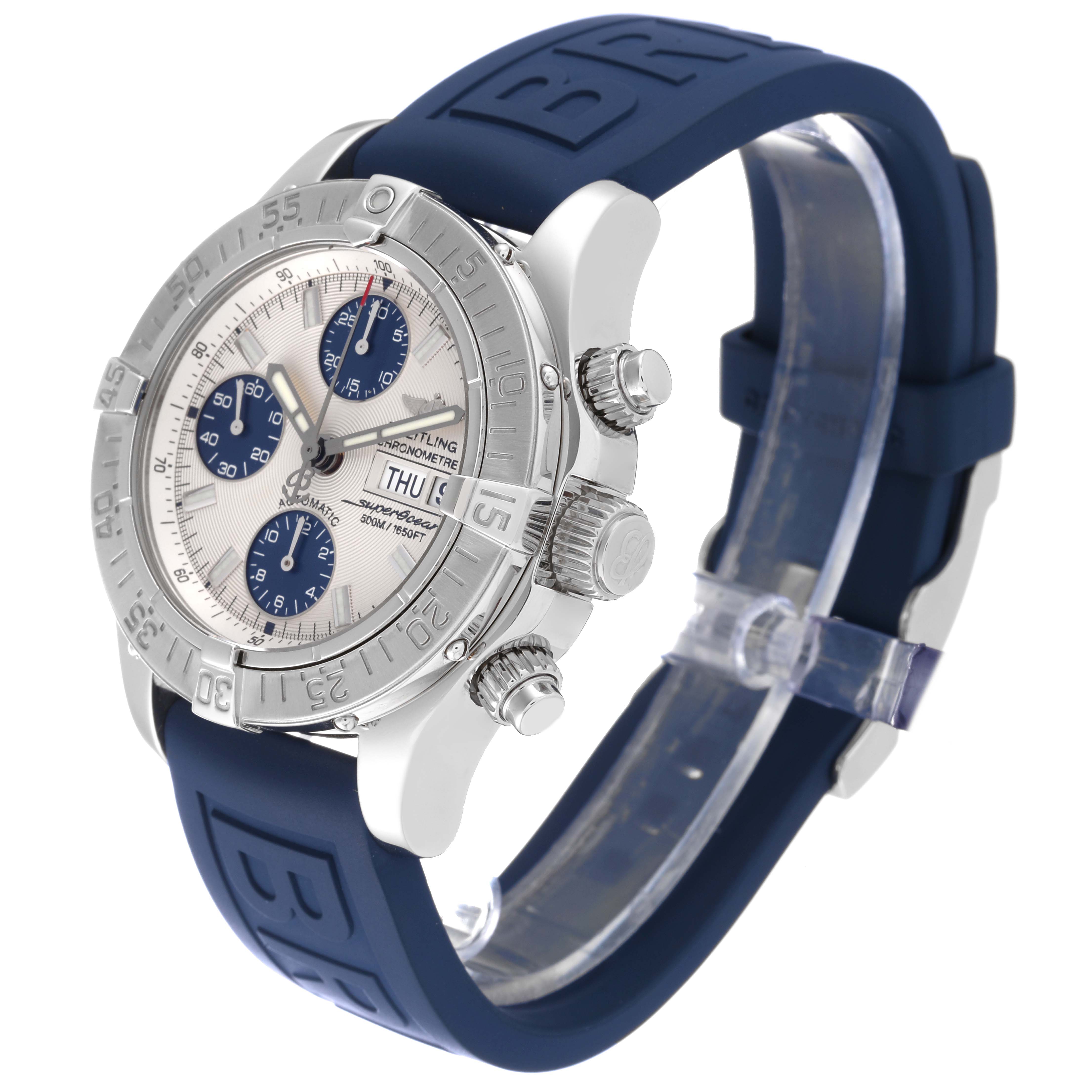 The Breitling Superocean A13340 Men's Stainless Steel Silver Dial A13340 Men's Stainless Steel Silver Dial watch is shown at an angle revealing the bezel, dial, crown, chronograph pushers, and blue rubber strap.