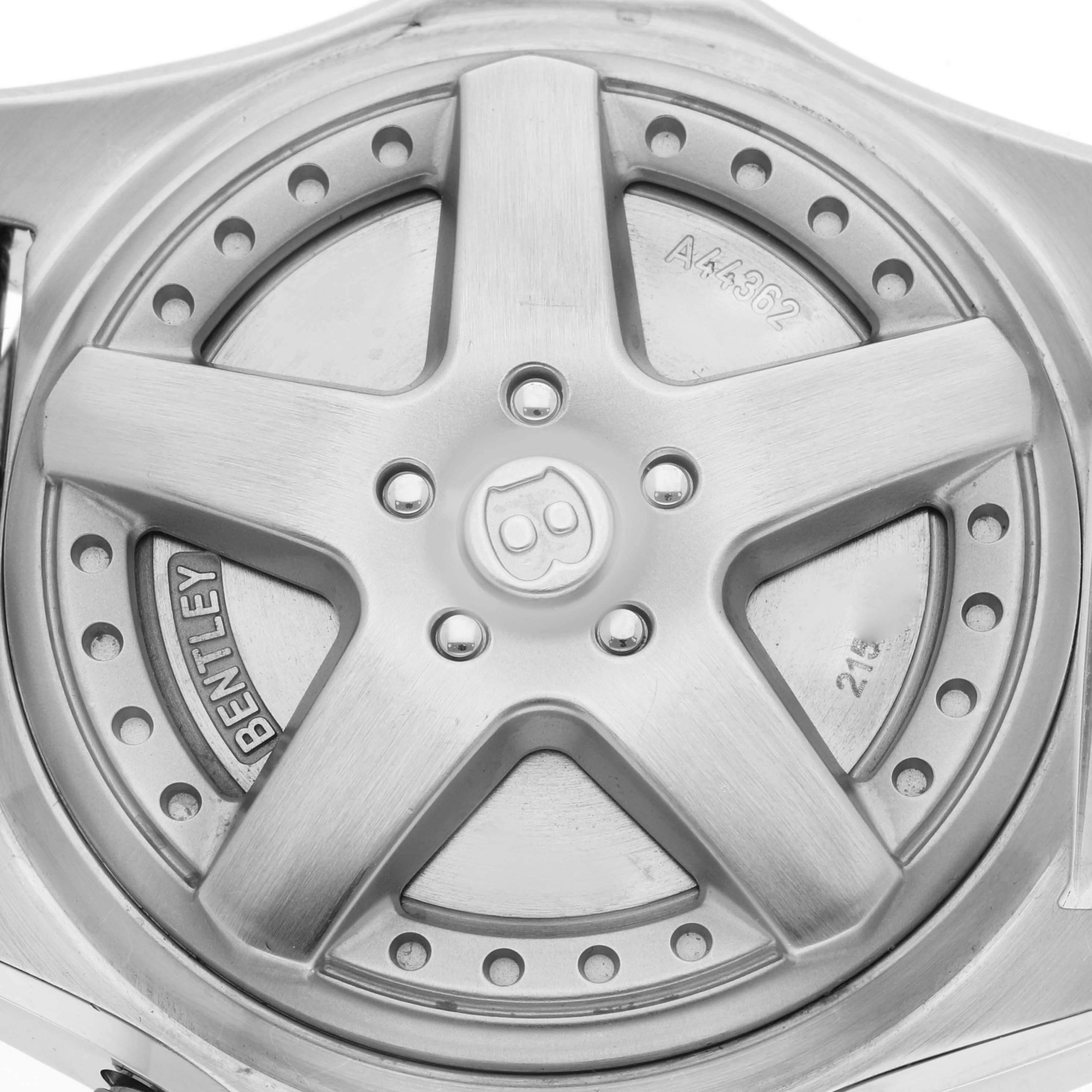 The image shows the back case of a Bentley model watch by Breitling, featuring a wheel-like design.