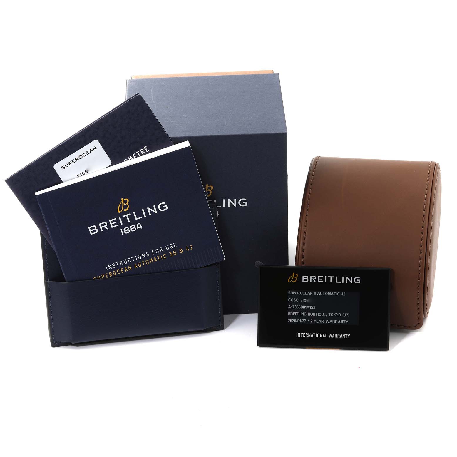 The image shows packaging and accessories for the Breitling Superocean A17366 Men's Stainless Steel White Dial A17366 Men's Stainless Steel White Dial model, including manuals, a warranty card, and a watch case.