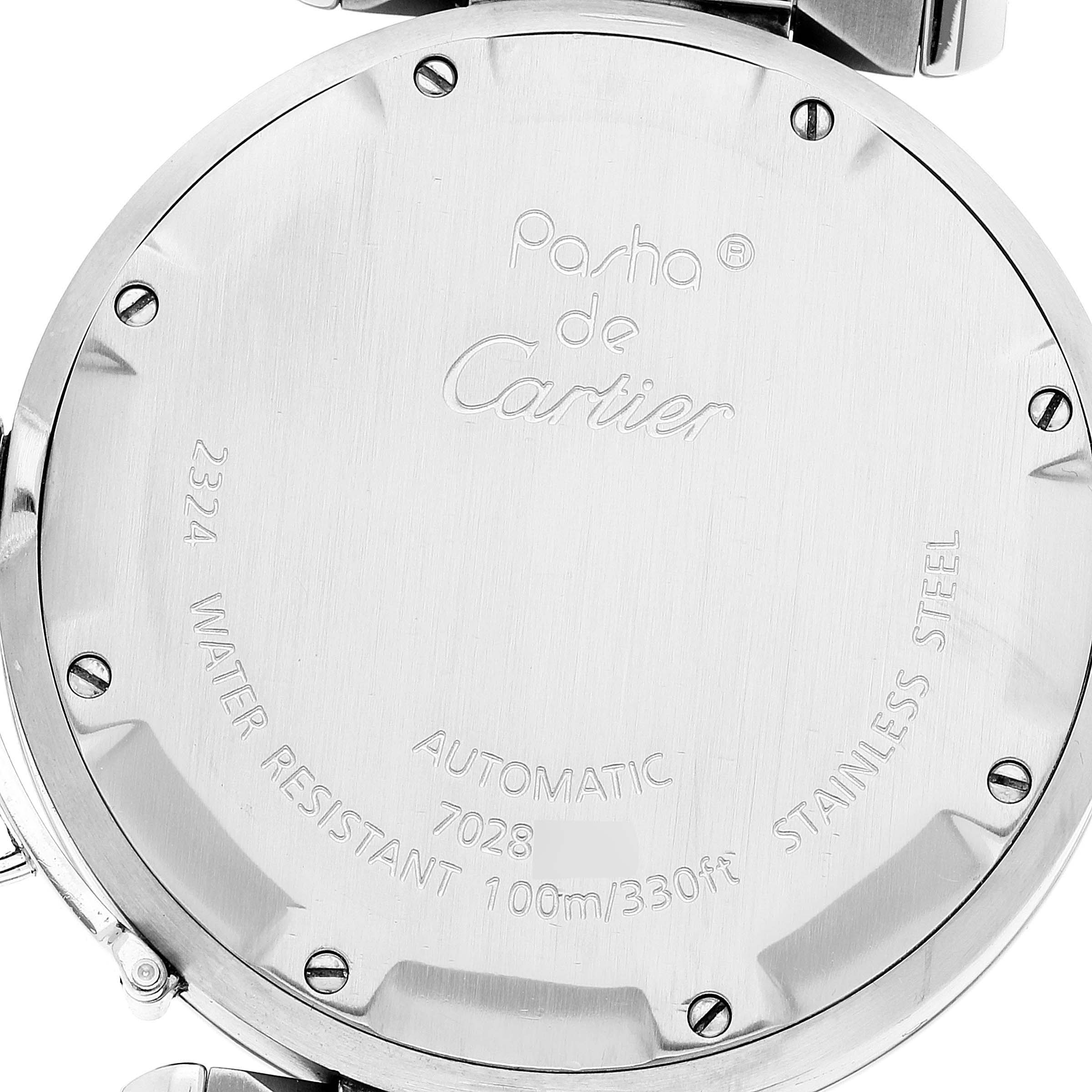 This image shows the back casing of a Cartier Pasha W31074M7 Men's Stainless Steel White Dial W31074M7 Men's Stainless Steel White Dial watch, highlighting its inscriptions and screw details.