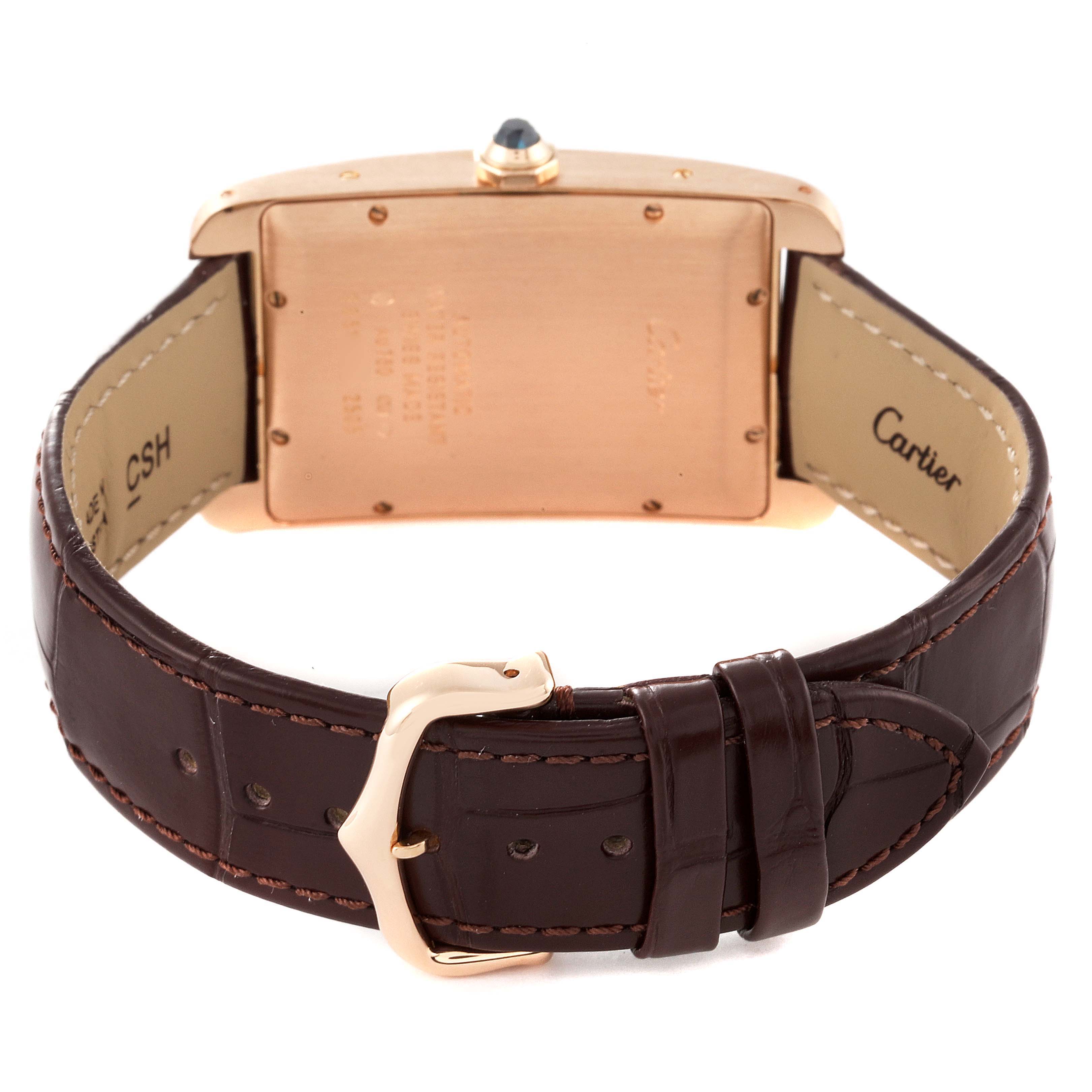 The image shows the back view of a Cartier Tank Américaine watch, highlighting the caseback, buckle, and leather strap.