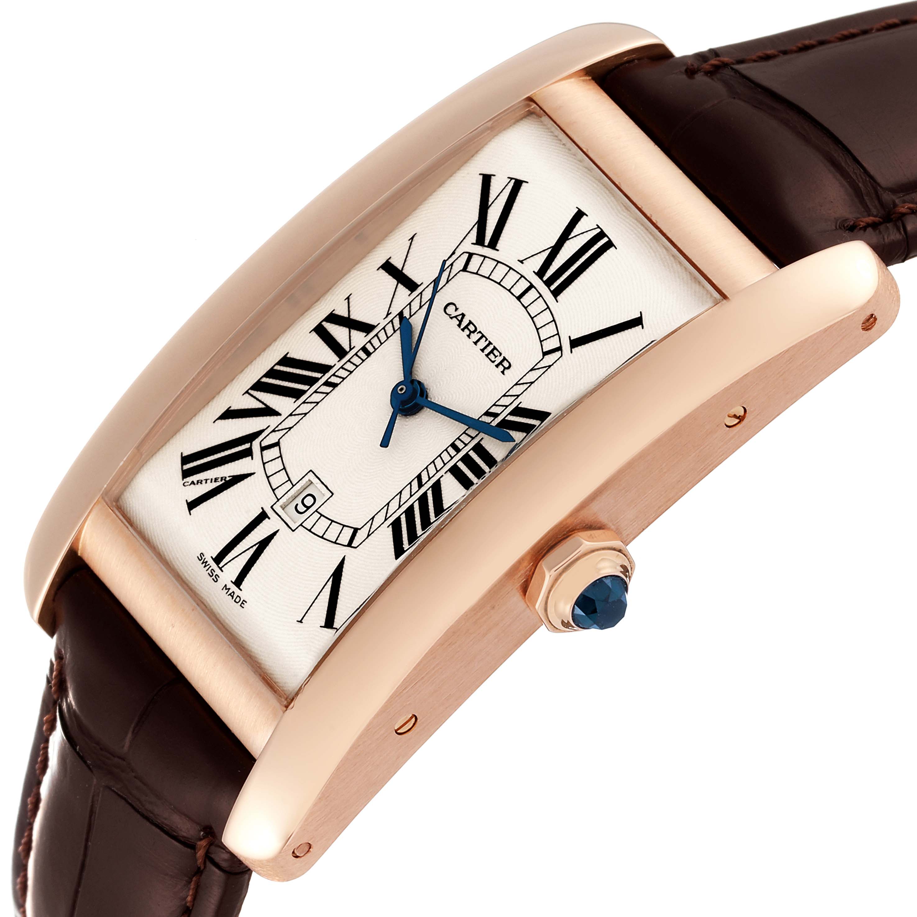 The image shows a close-up, angled view of the Cartier Tank Américaine watch, highlighting its dial, crown, and leather strap.