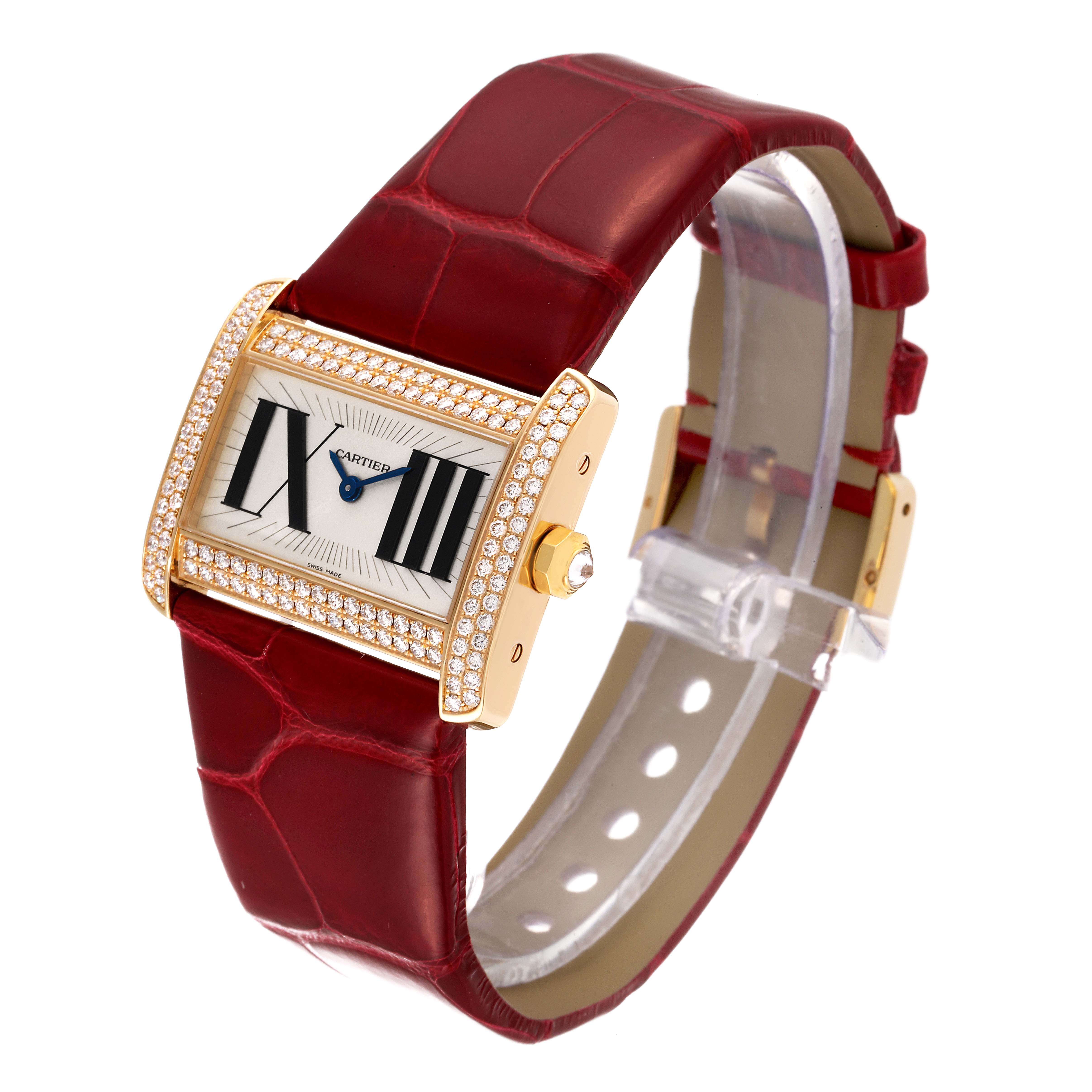 The Cartier Tank Divan WA301471 Women
s Yellow Gold Silver Dial WA301471 Women
s Yellow Gold Silver Dial watch is shown at a slight angle, highlighting its rectangular face, red leather strap, and diamond-set bezel.