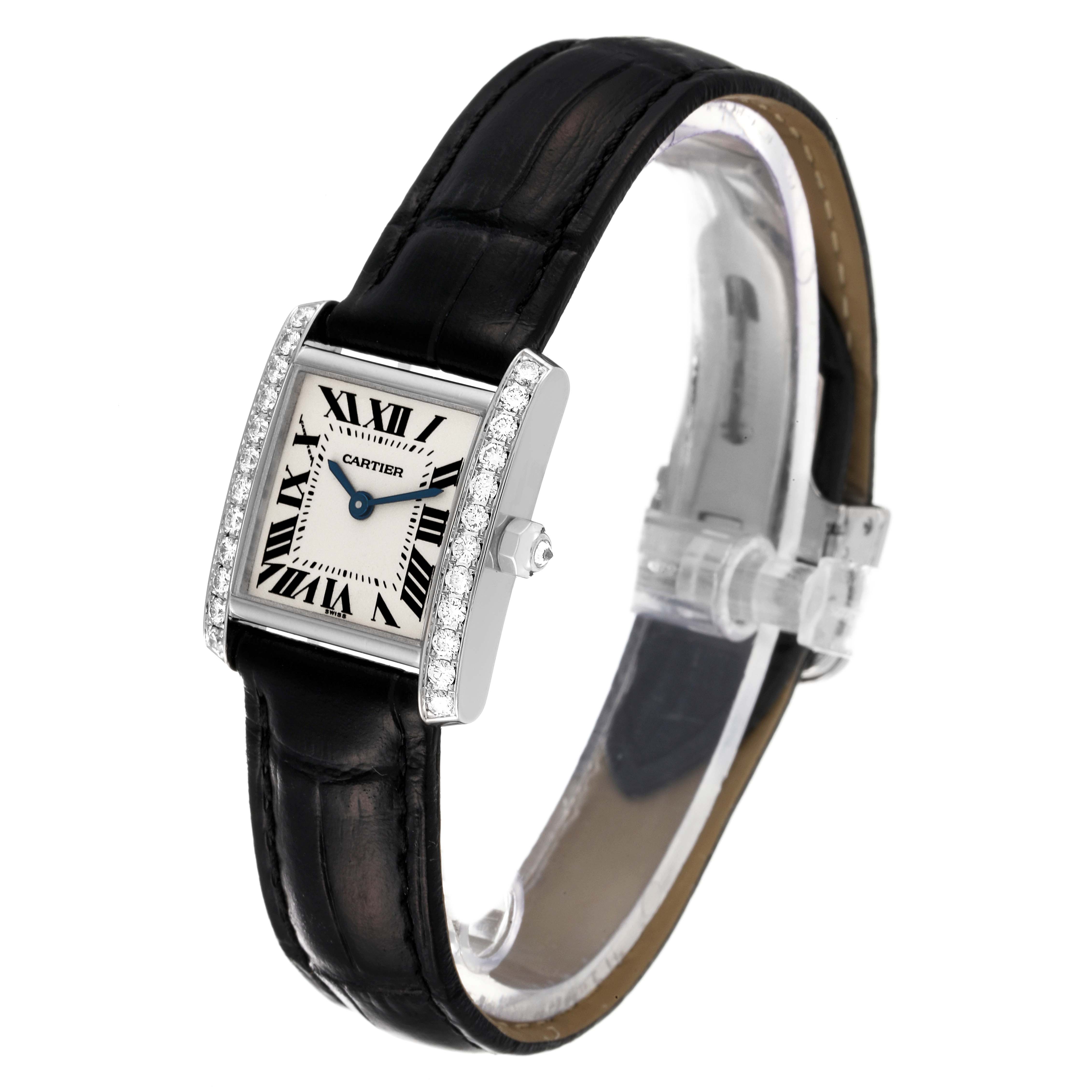 The image shows a Cartier Tank Francaise WE100251 Women's White Gold Silver Dial WE100251 Women's White Gold Silver Dial watch at an angle, highlighting its face, black leather strap, and diamond-studded bezel.