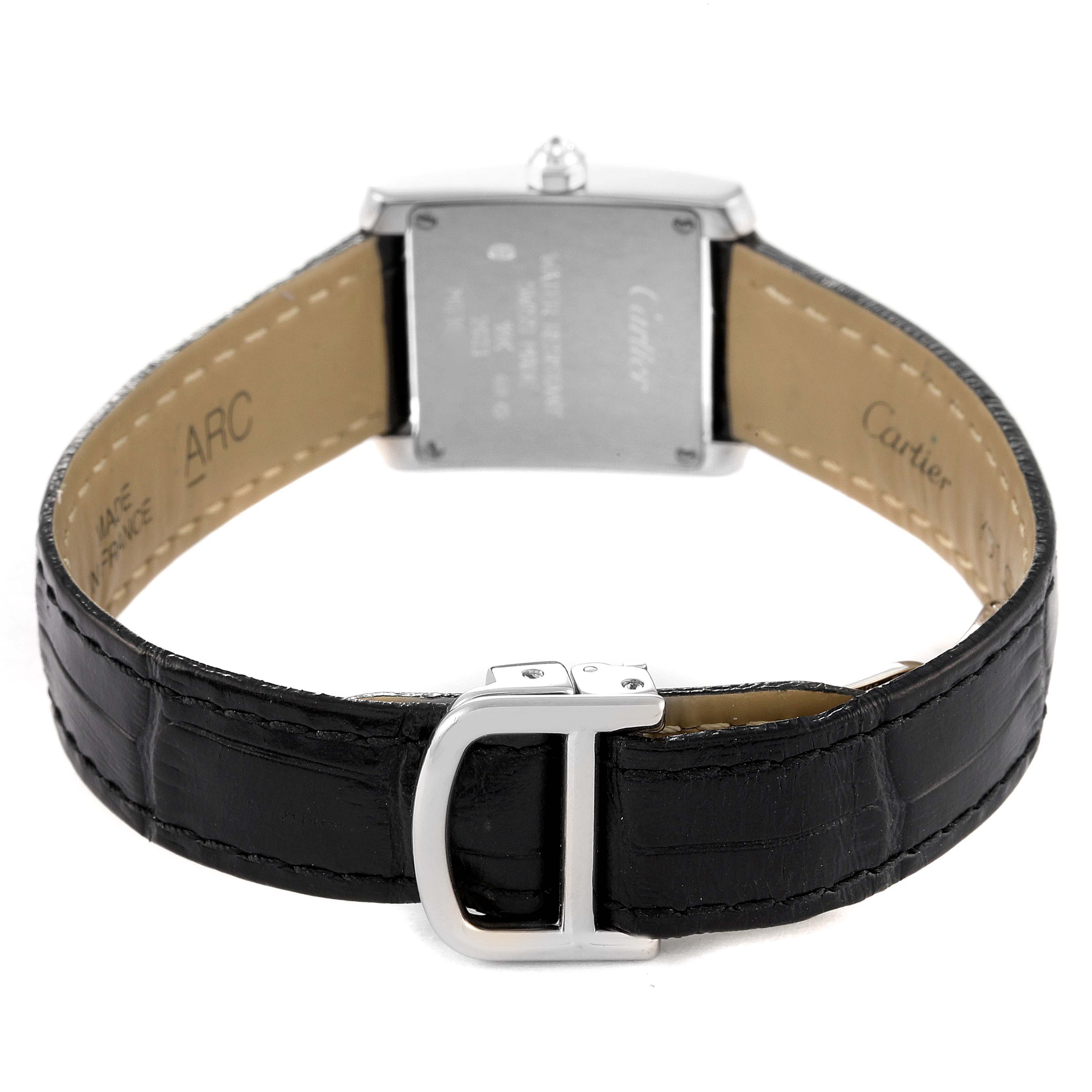 The image shows the back view of a Cartier Tank Française watch, highlighting its case back, leather strap, and buckle.