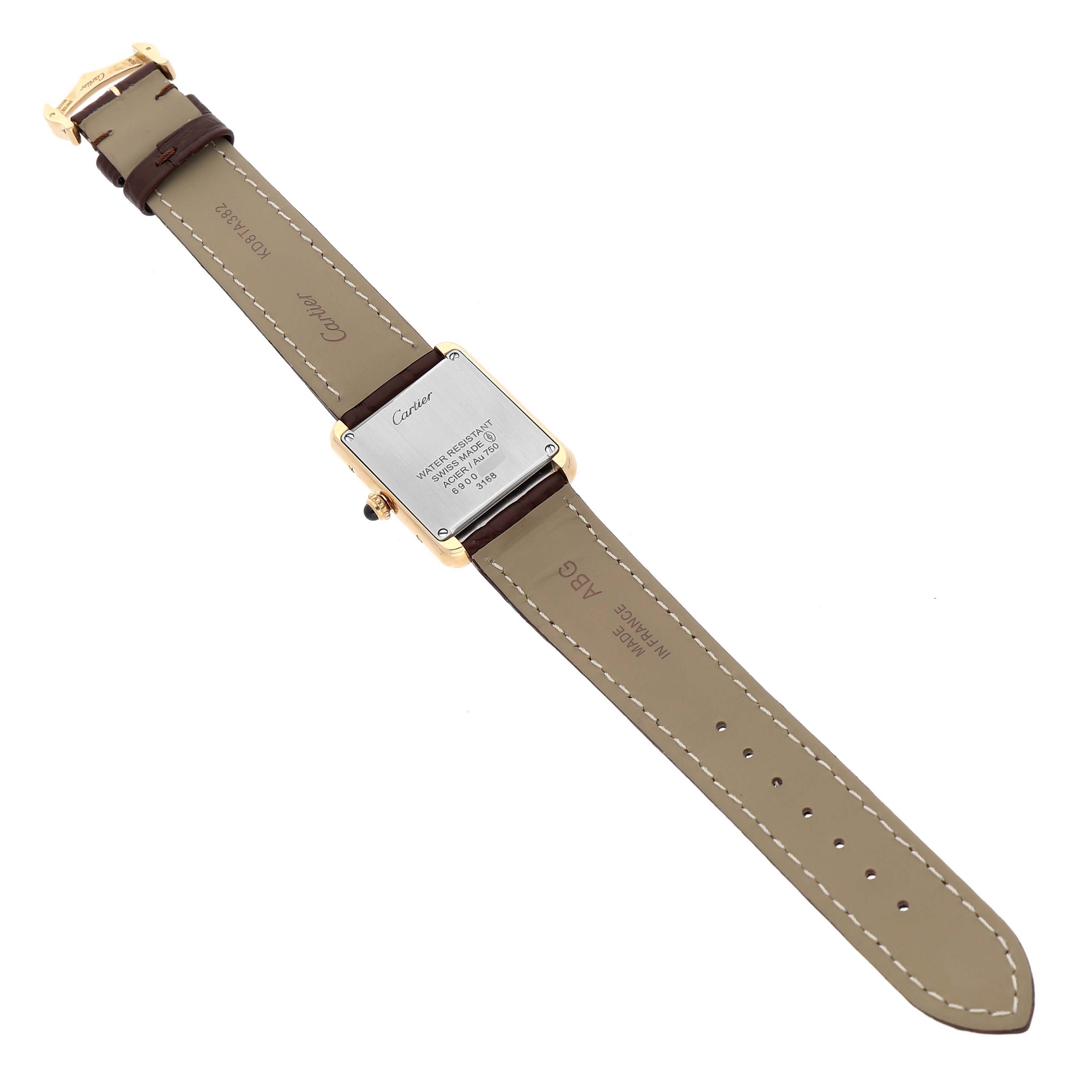 The Cartier Tank Solo W5200002 Women's Steel and Gold (two tone) Silver Dial watch is shown from the back, displaying the case back, strap, and buckle.