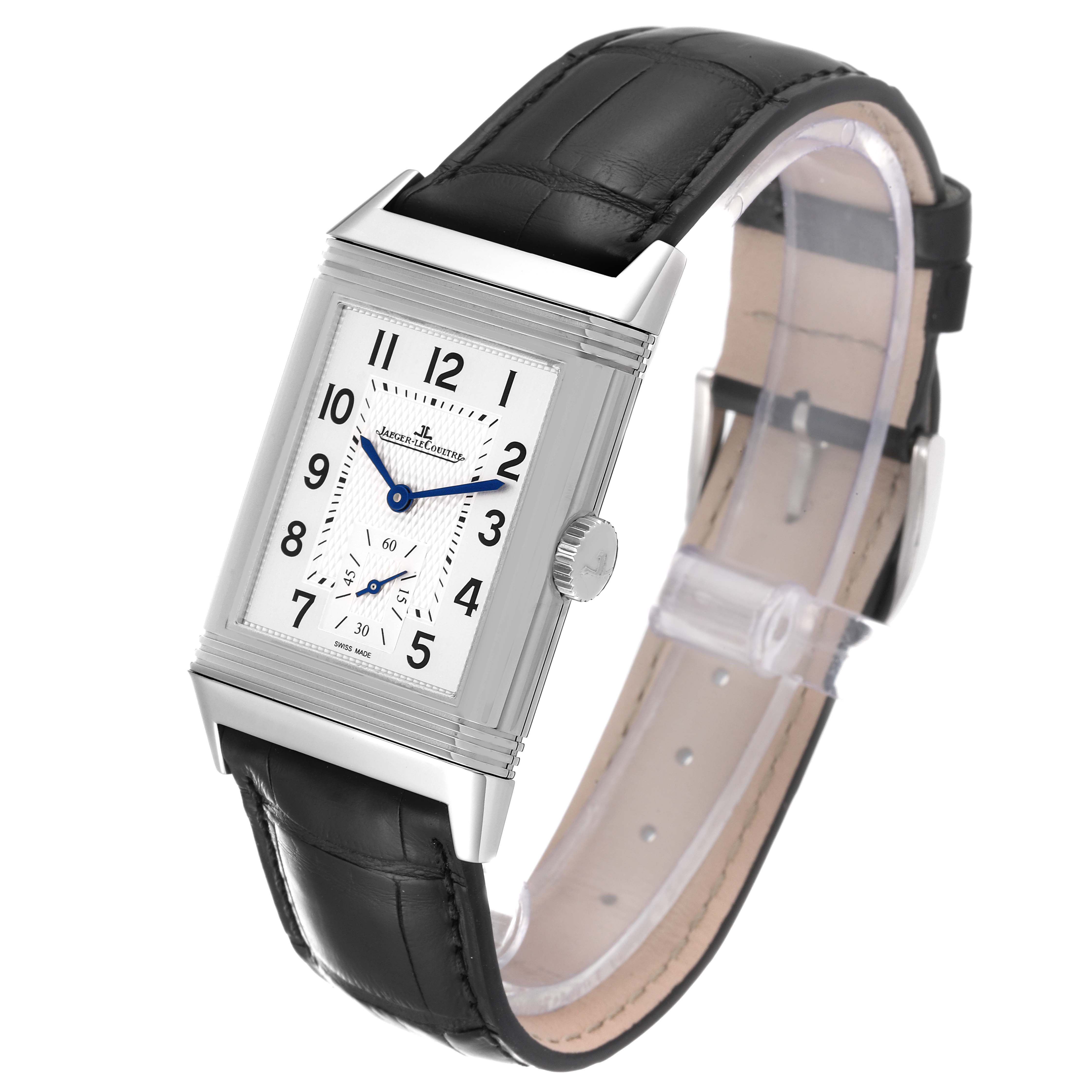 The image shows a Jaeger-LeCoultre Reverso watch at a three-quarter angle, featuring its rectangular face and black leather strap.