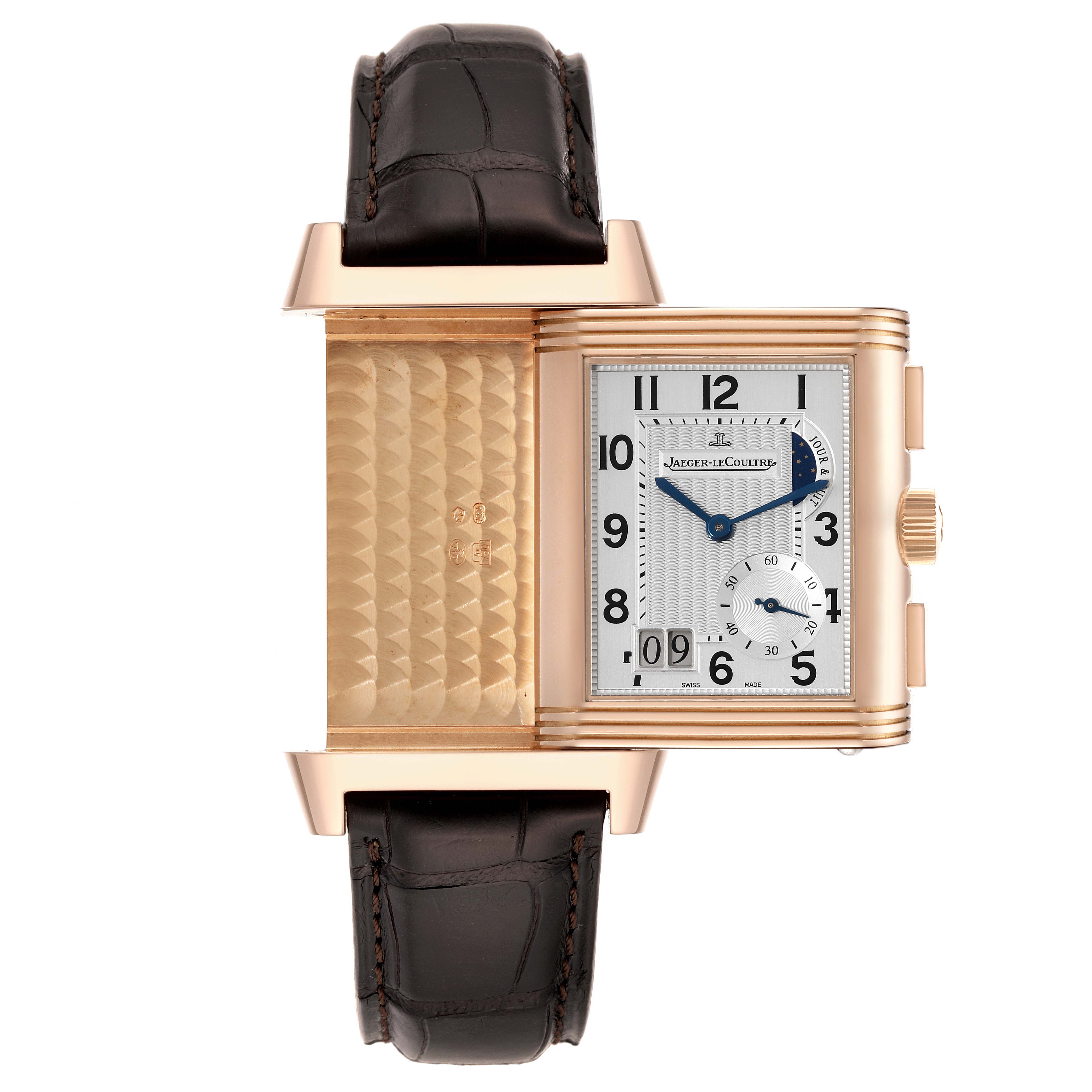 This image shows the Jaeger LeCoultre Reverso Q3022420 Men's Rose Gold Silver Dial Q3022420 Men's Rose Gold Silver Dial watch with the case flipped to reveal the decorative back and face details.