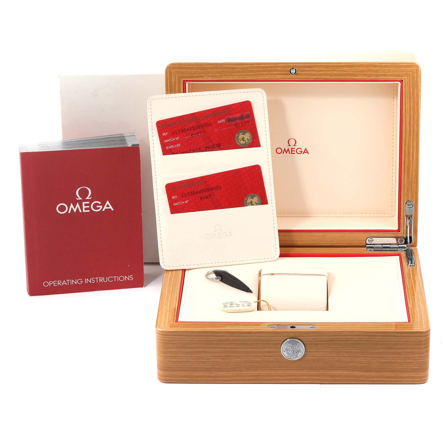 The photo shows the Omega Seamaster 212.30.44.50.03.001 Men's Stainless Steel Blue Dial 212.30.44.50.03.001 Men's Stainless Steel Blue Dial watch box, warranty cards, instruction manual, and tag from a front angle.