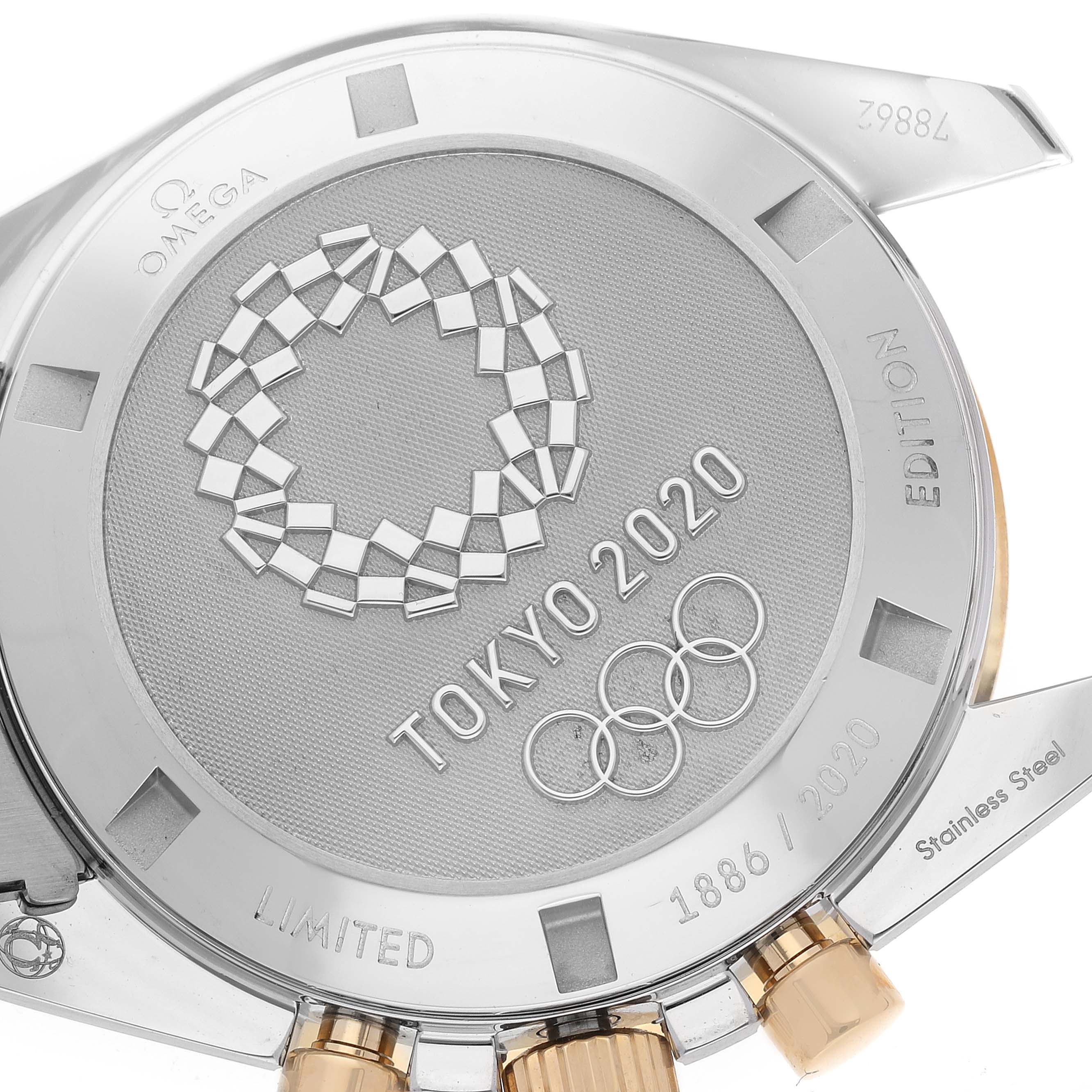 The image shows the caseback of the Omega Speedmaster 522.20.42.30.01.001 Men's Steel and Gold (two tone) Black Dial 522.20.42.30.01.001 Men's Steel and Gold (two tone) Black Dial Tokyo 2020 Limited Edition with engravings and logos.