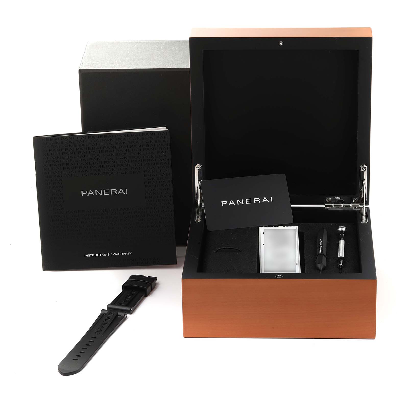 The image shows the box, manual, card, tools, and an additional strap for the Panerai Luminor PAM01321 Men
s Stainless Steel Black Dial PAM01321 Men
s Stainless Steel Black Dial watch from a front angle.