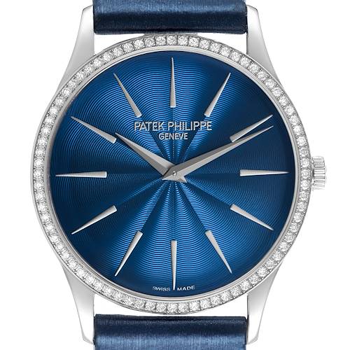 The image shows a Patek Philippe Calatrava 4997 Women's White Gold Blue Dial watch from the front, highlighting its blue dial, diamond-set bezel, and silver markers.