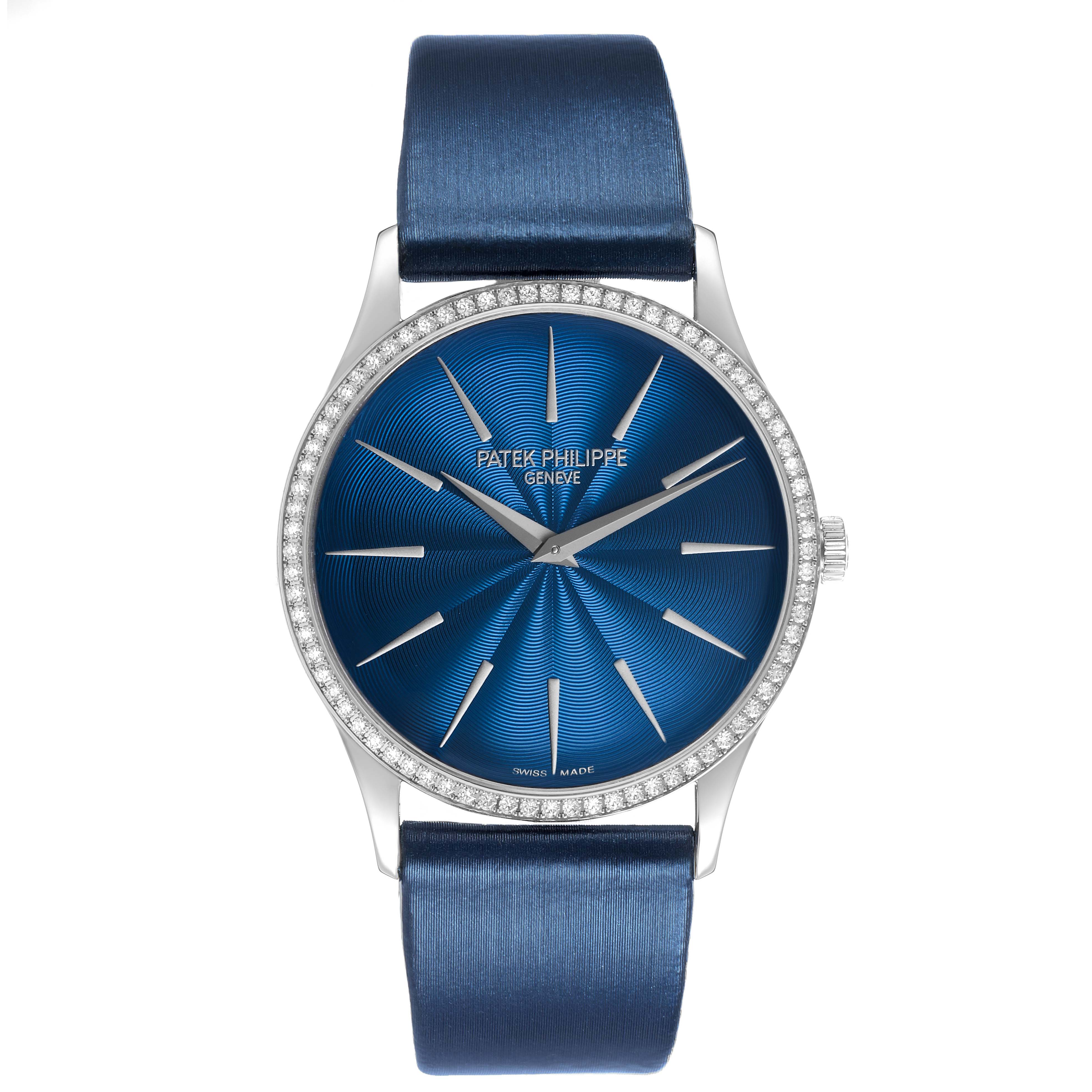 The Patek Philippe Calatrava 4997 Women's White Gold Blue Dial watch is shown from the front, highlighting the blue dial, hour markers, and diamond bezel.
